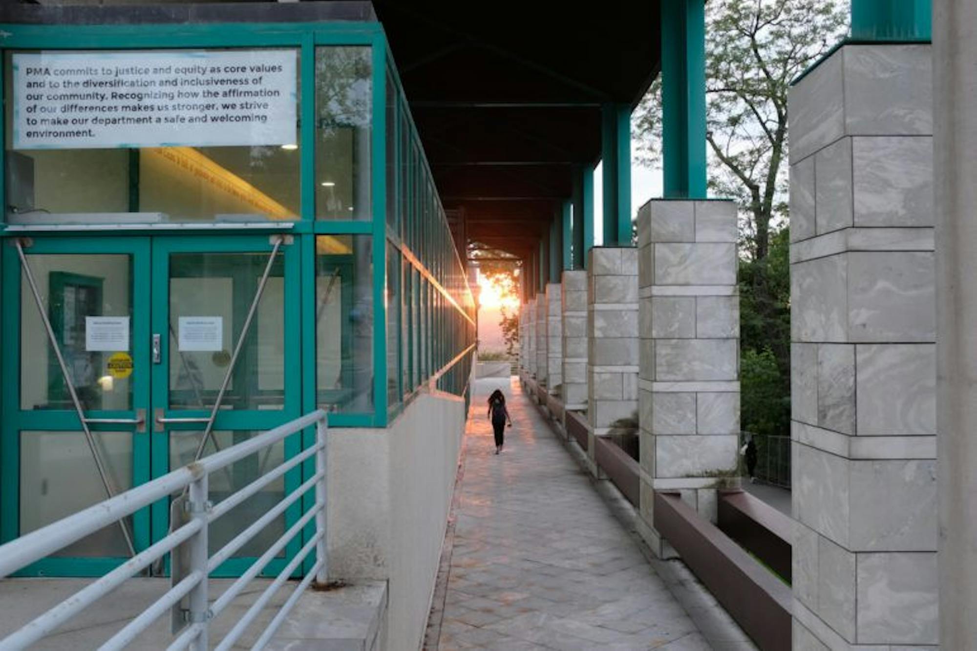 The sun sets over the Schwartz Performing Arts Center on Tuesday. (Michael Wenye Li / Sun Photography Editor)