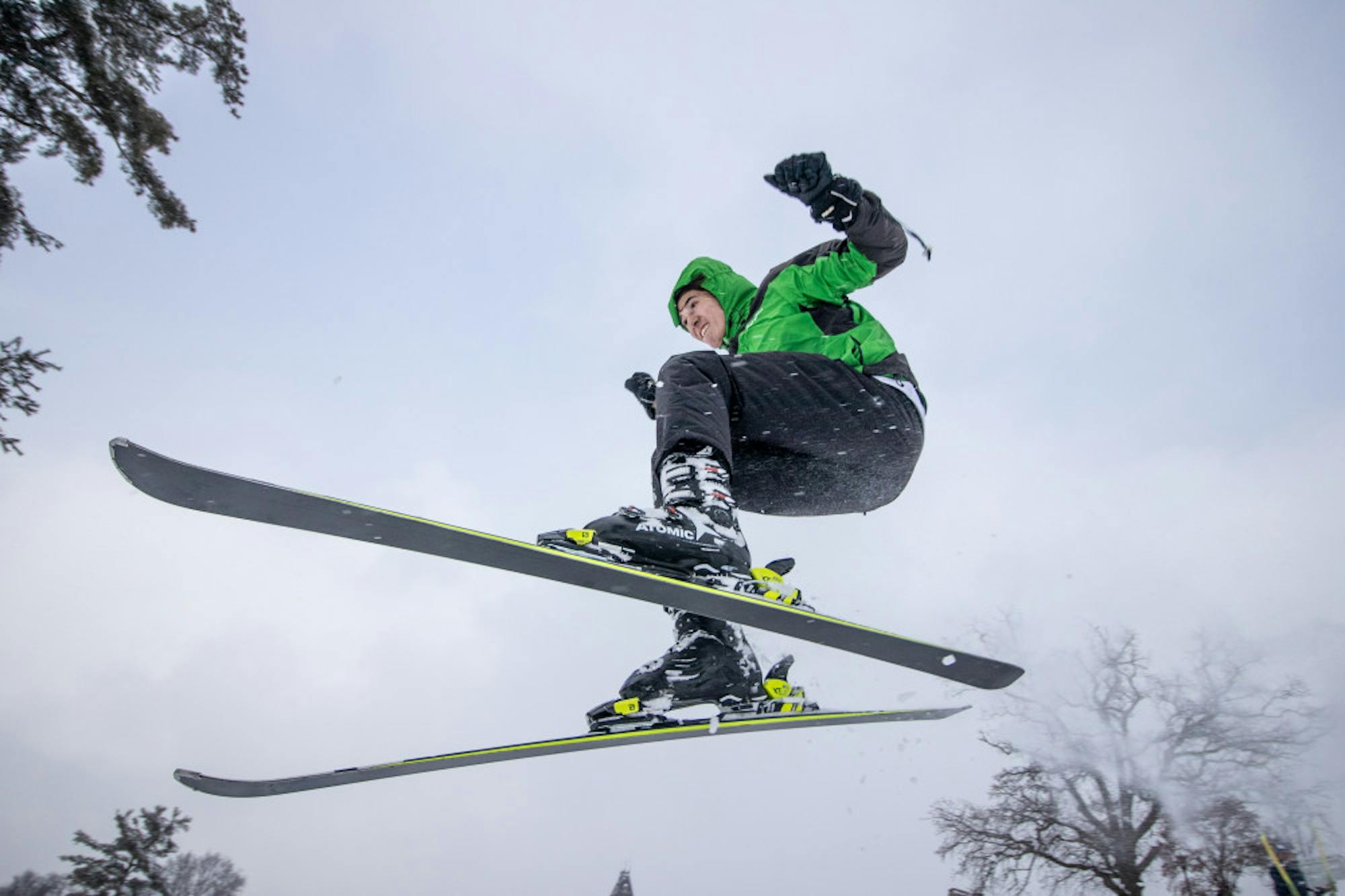 Sebastian Dittgen '21 soars down Libe Slope on skis during the snow day on Friday. (Michael Wenye Li/Sun Senior Photographer)