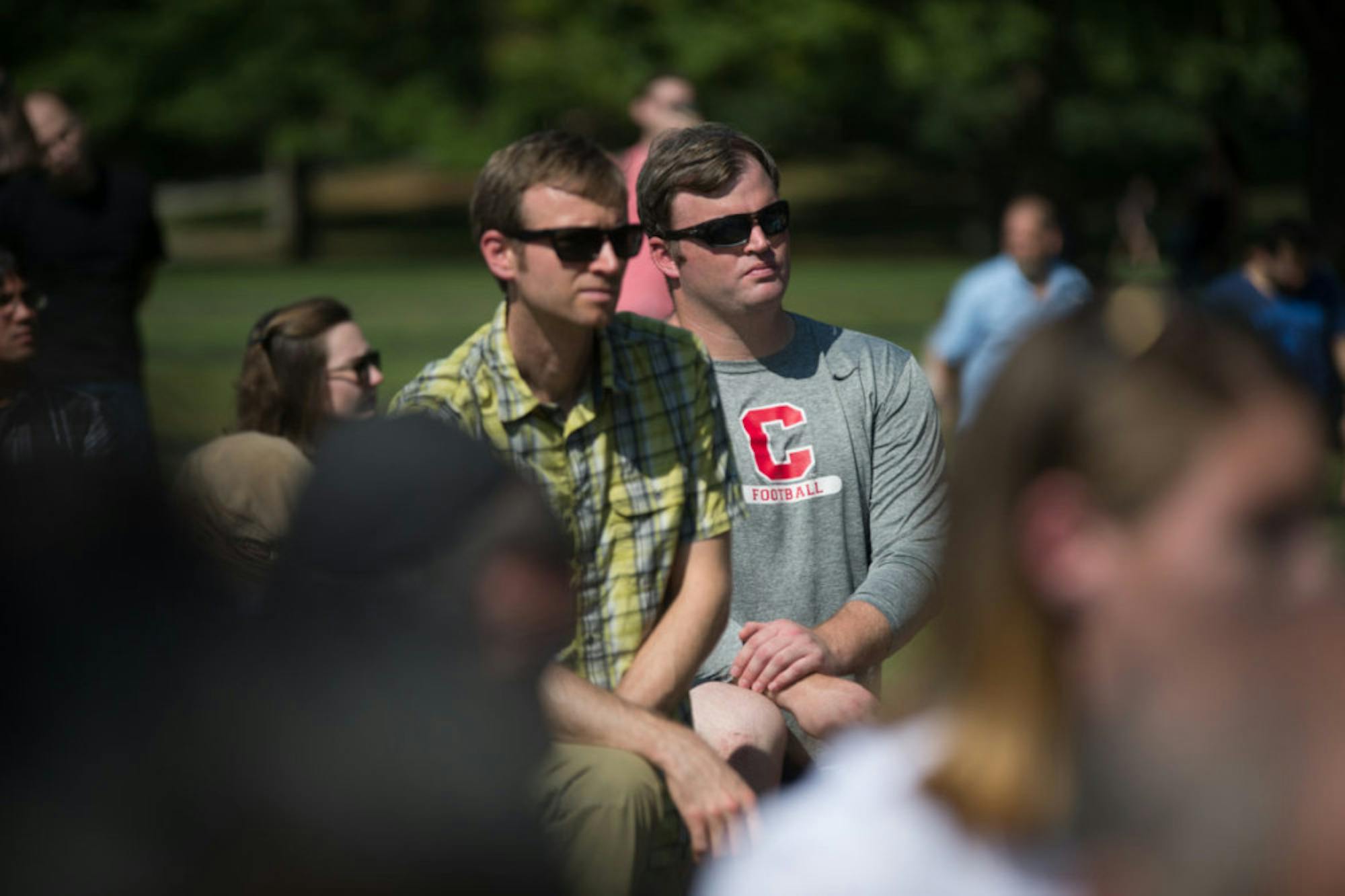 Head coach David Archer '05 takes a knee during a Sept. 27 demonstration on the Arts Quad. Various other members of the team were in attendahce as well.
