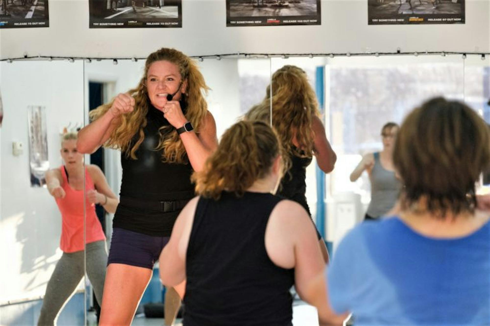 Jessica Kerns teaches a body combat class at FLX Fitclub, a fitness club founded by alumna Chantelle Farmer '91, on Tuesday, 26 Sep. (Michael Suguitan / Sun Staff Photographer).
