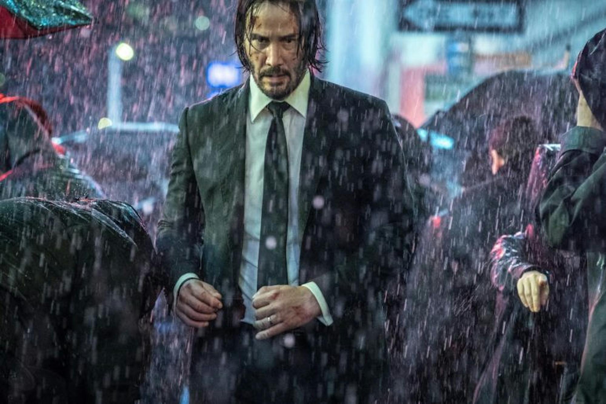 Keanu Reeves looks intimidating in the rain.