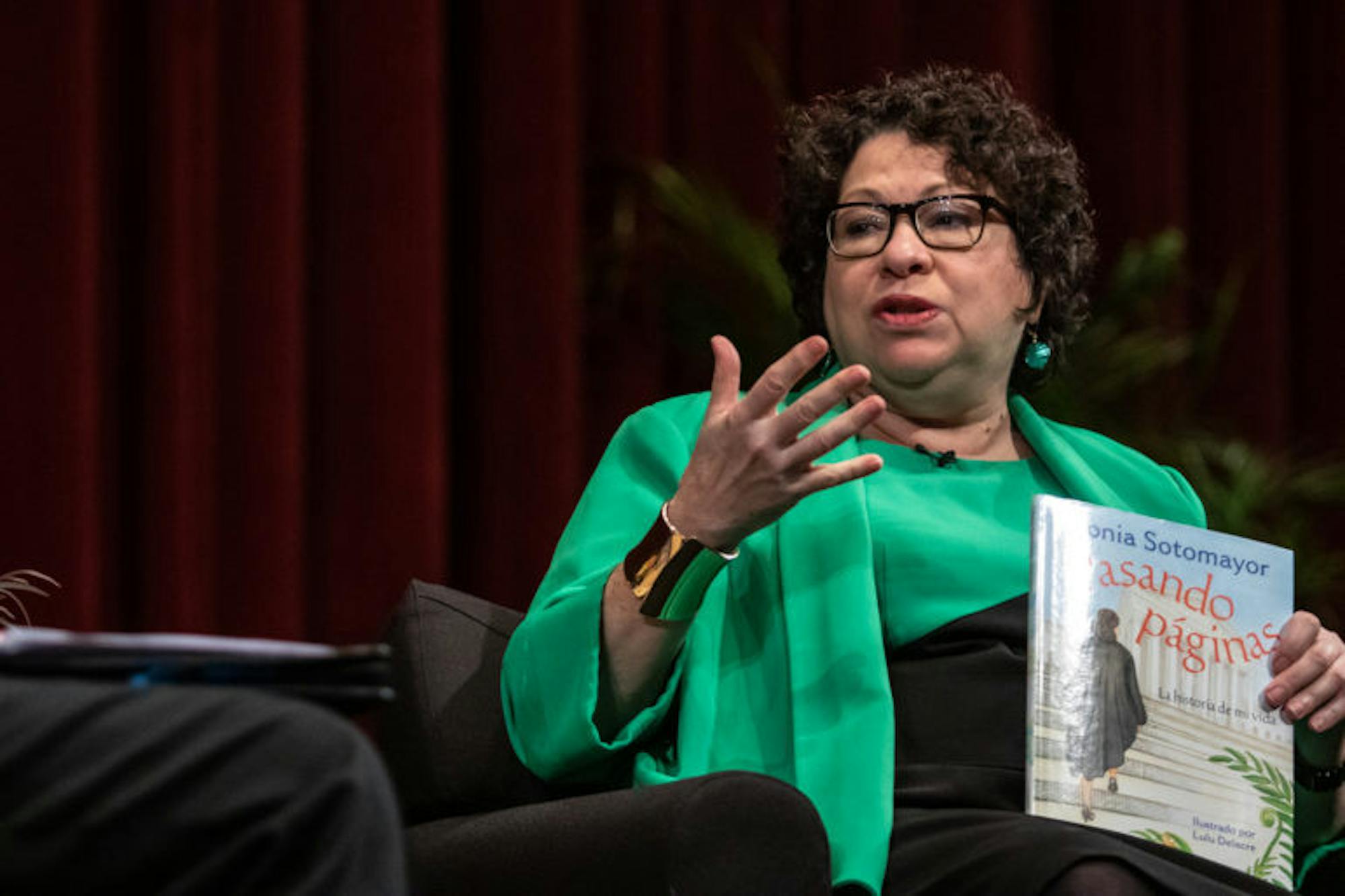 Justice Sonia Sotomayor holds a Spanish copy of her newly-published children's book, Turning Pages: My Life Story.