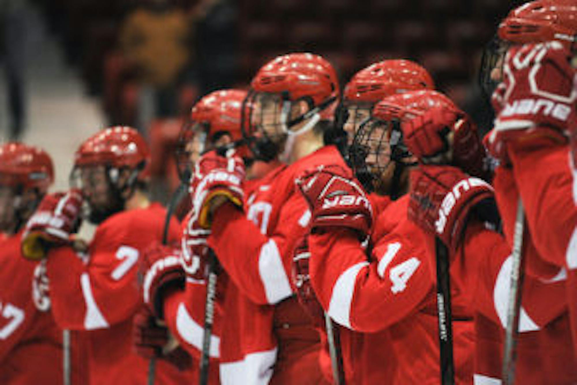 Sophomore forward #14 Mitch Vanderlaan watches as Harvard is crowned ECAC Hockey Champions on Saturday night in Lake Placid. (Cameron Pollack / Sun Photography Editor)