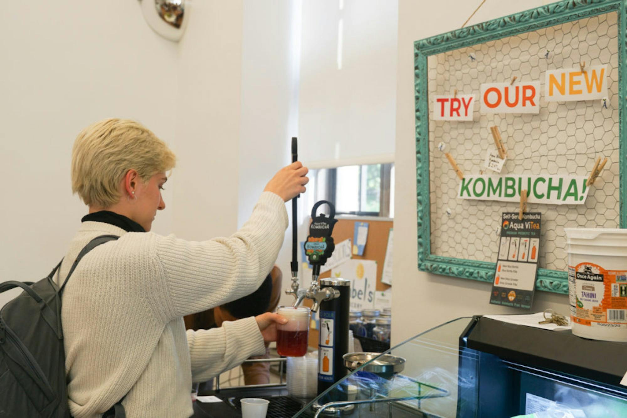 A kombucha tap is available in the grocery store.