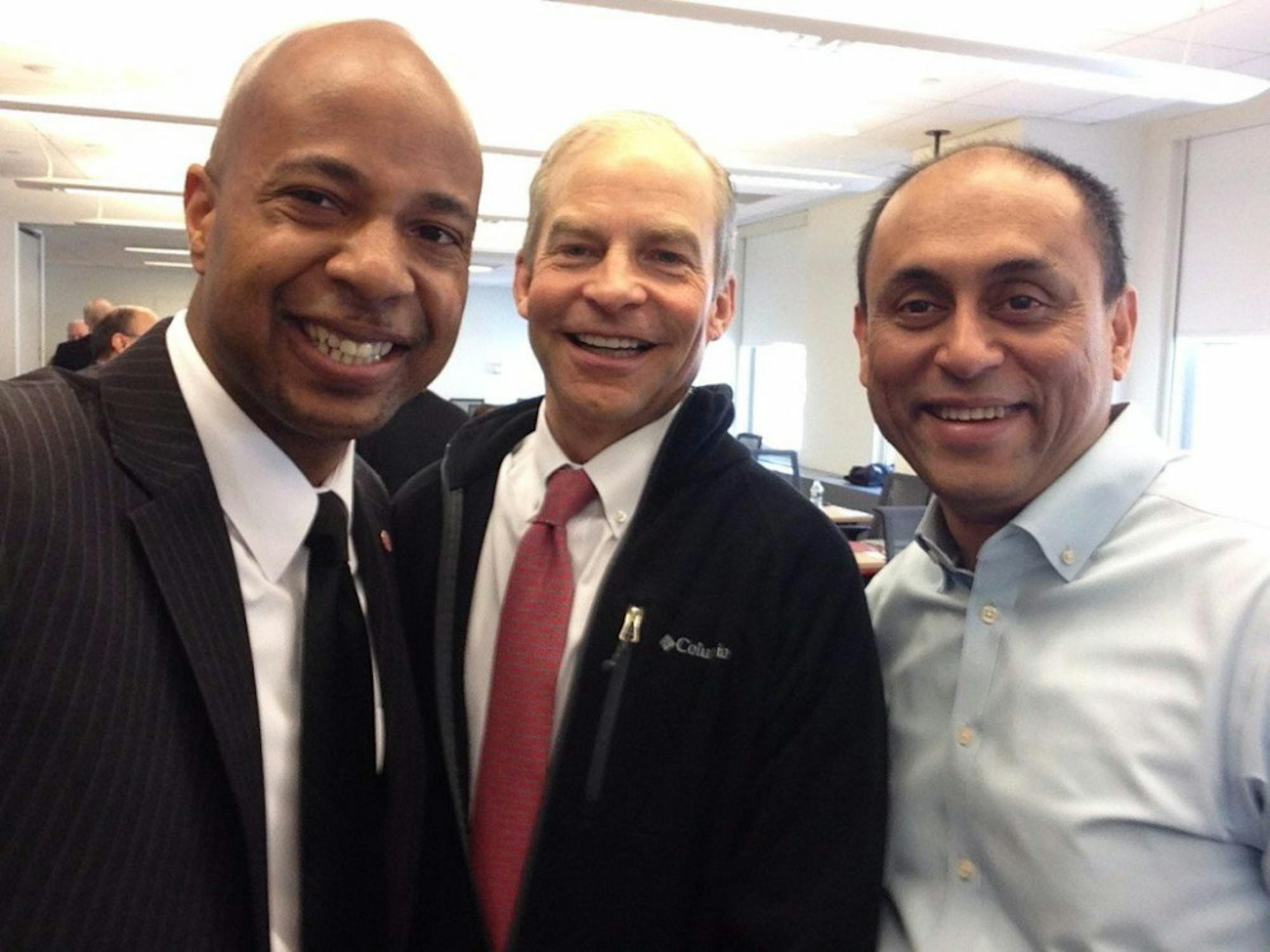 Prof. Soumitra Dutta, right, the former dean of the College of Business, with H. Fisk Johnson '79, center, the CEO of SC Johnson for whom the business college is named, in April 2016.