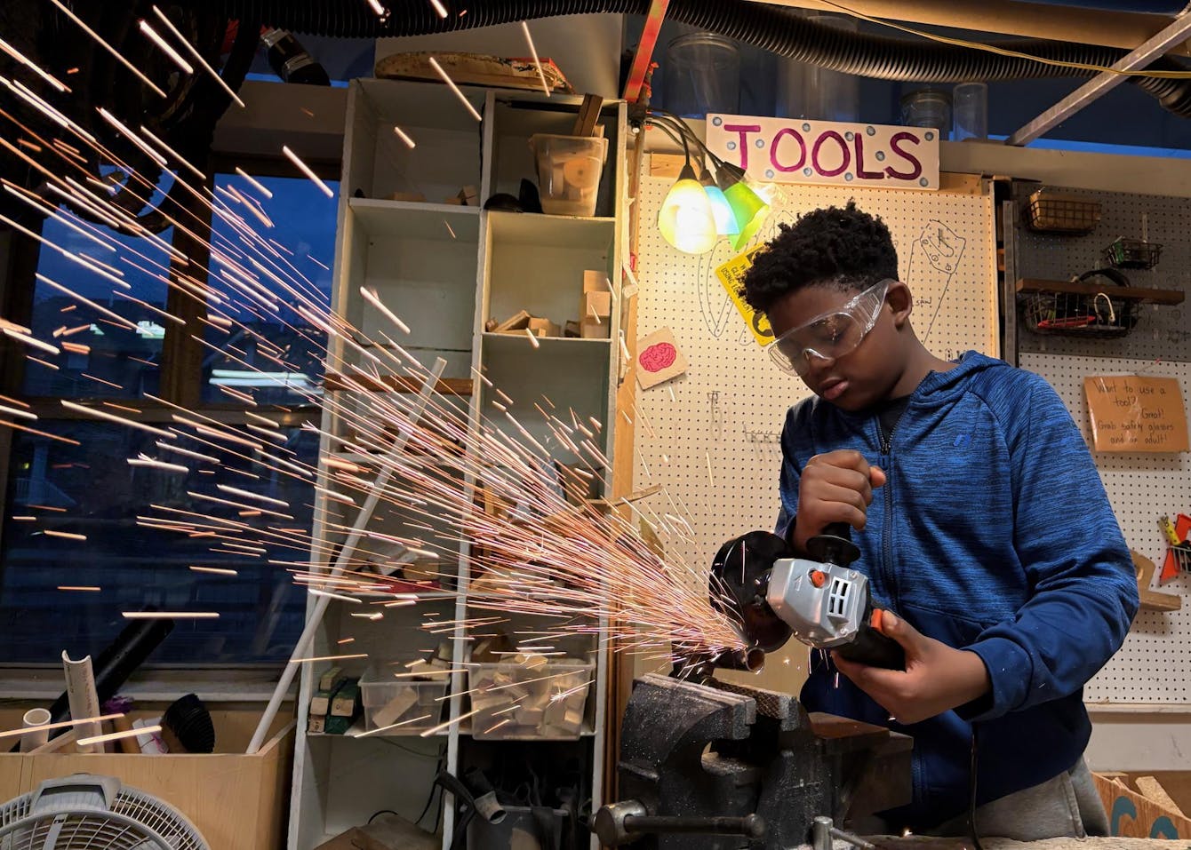 physics bus - kid cutting steel pipe.jpg