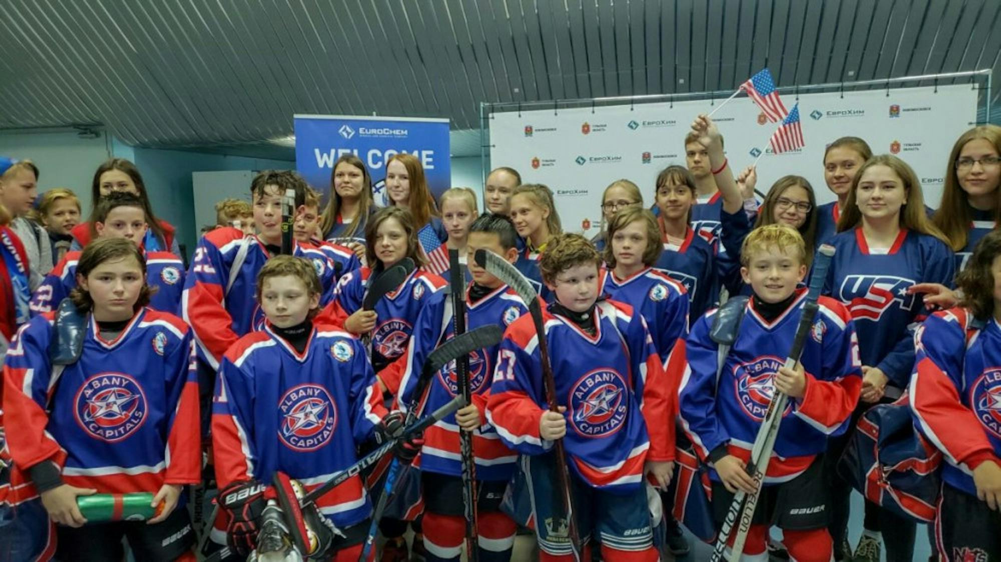The boys pose for a photo op following a game in Novomoskovsk.