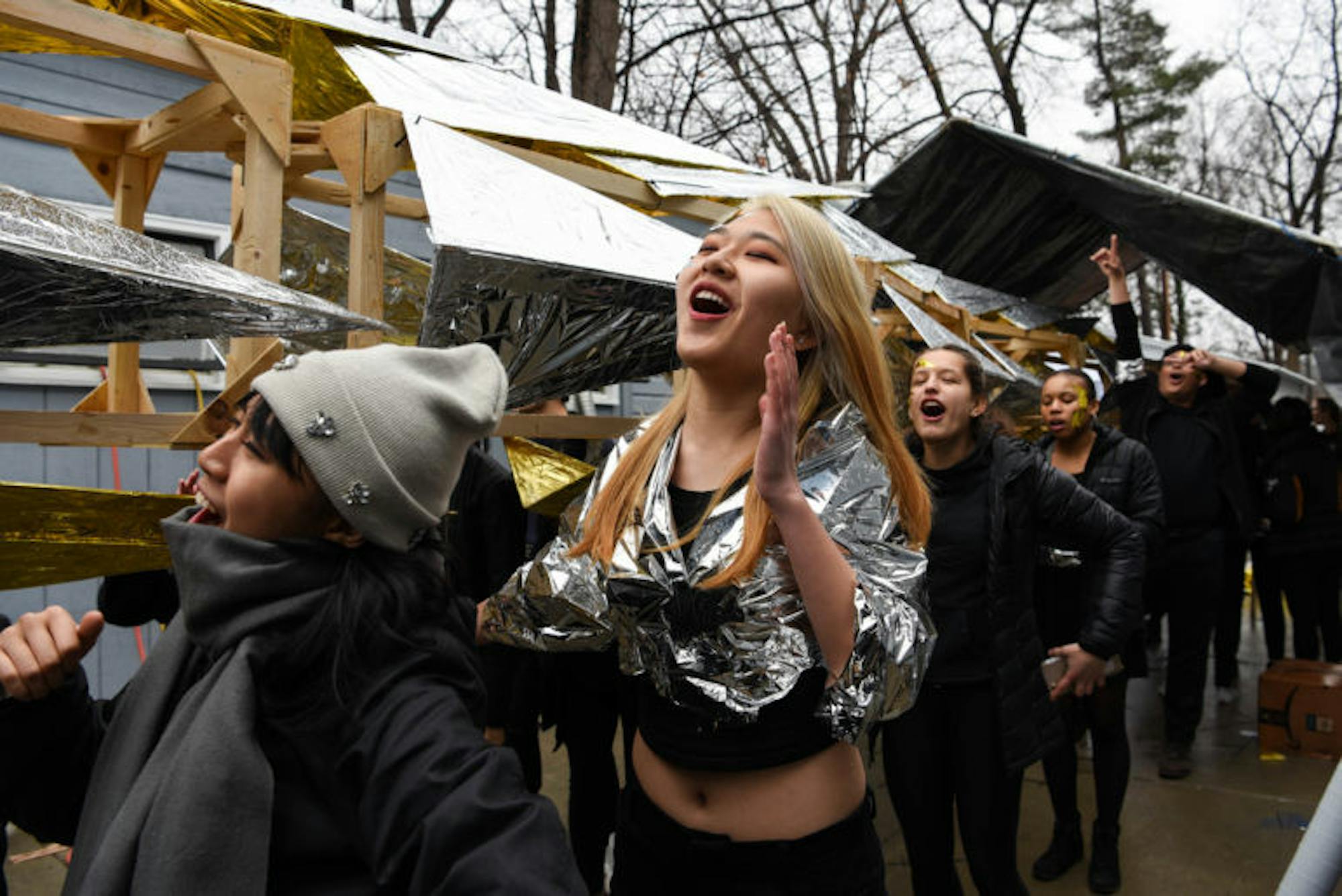 As the dragon gradually takes its shape, freshmen not involved in the final construction warm up for the parade with a series of chants.
