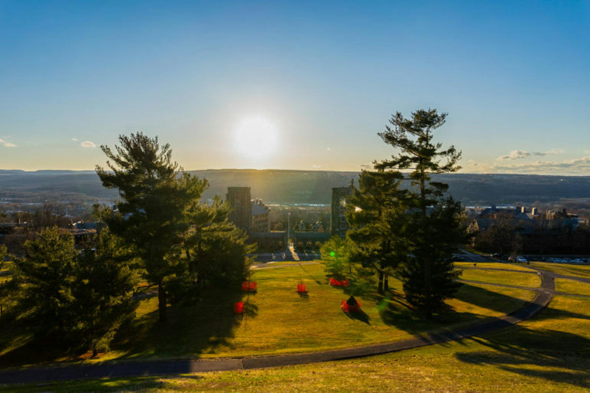 Libe Slope glows in the Friday-evening light. Despite the pressing public-health crisis, the sun continued to shine on West Campus. (Harry Dang/Sun Staff Photographer)