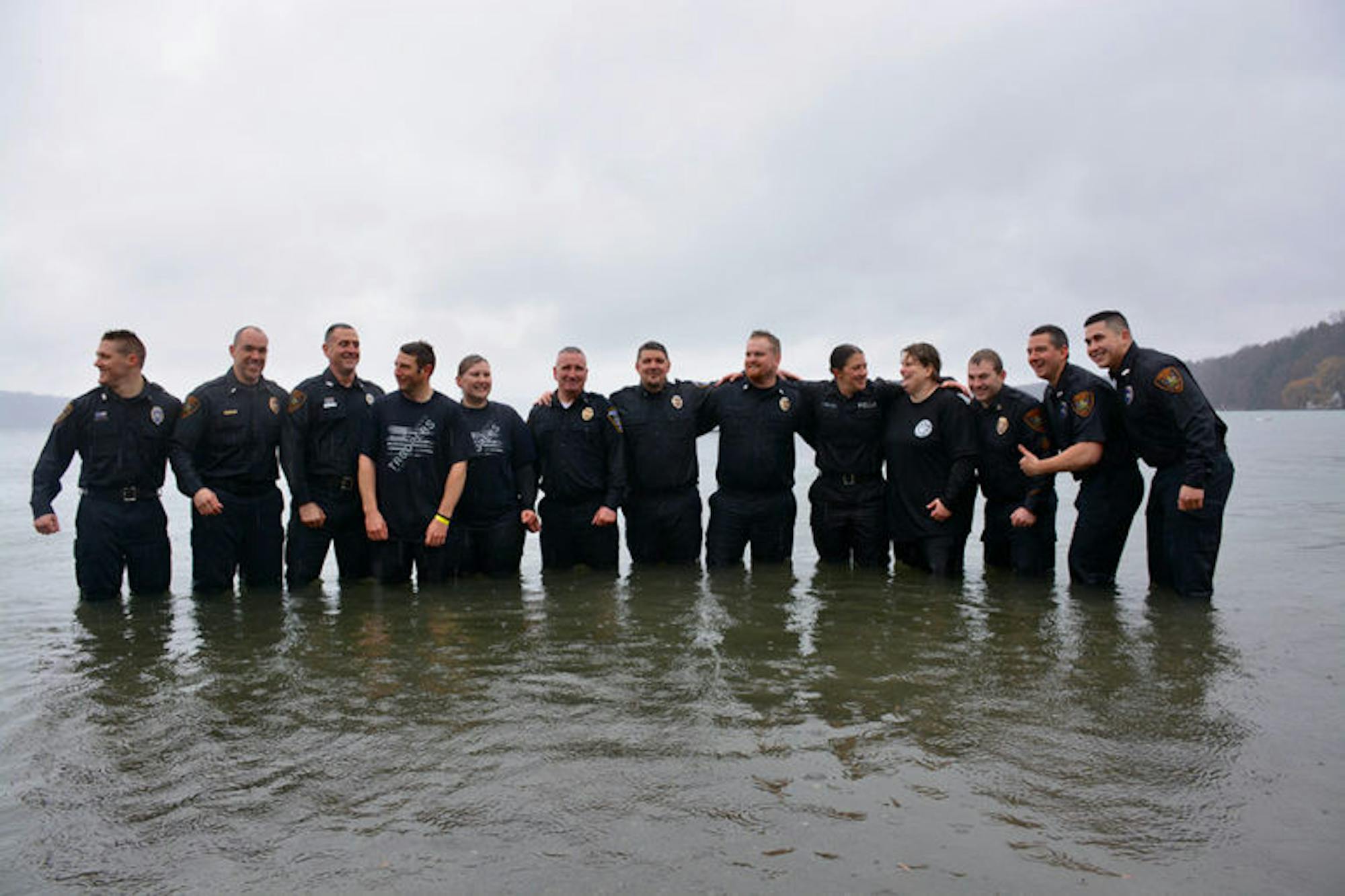 Members of the Ithaca Police Department stand for a group photo on Saturday moments before being splashed.