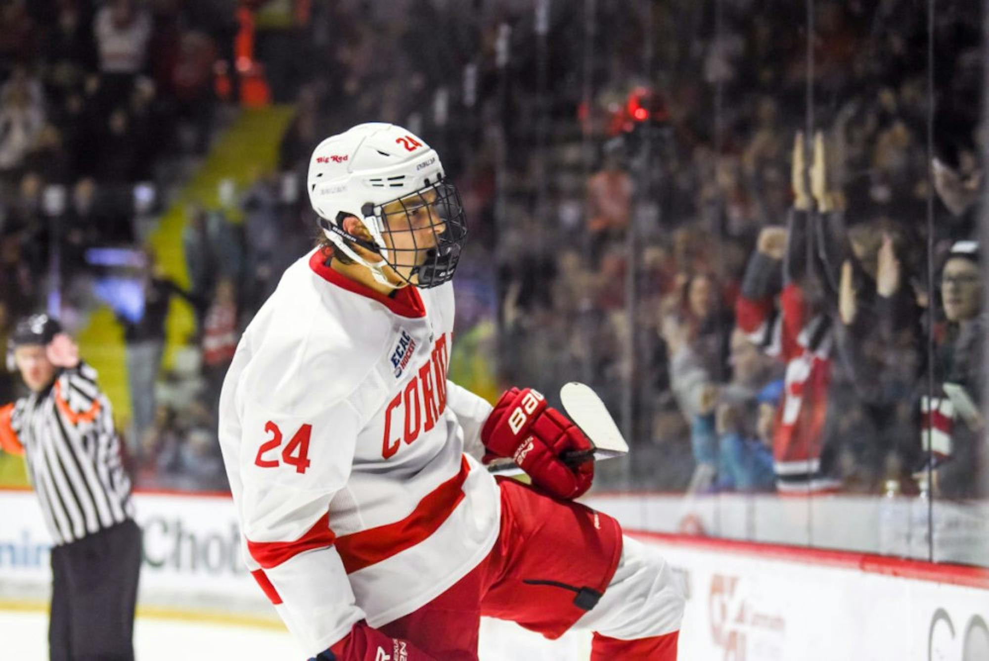 Freshman defenseman Sam Malinski celebrates after scoring a goal to put the Red up 2-1 at the game against Brown at Lynah Rink on Nov. 8, 2019.