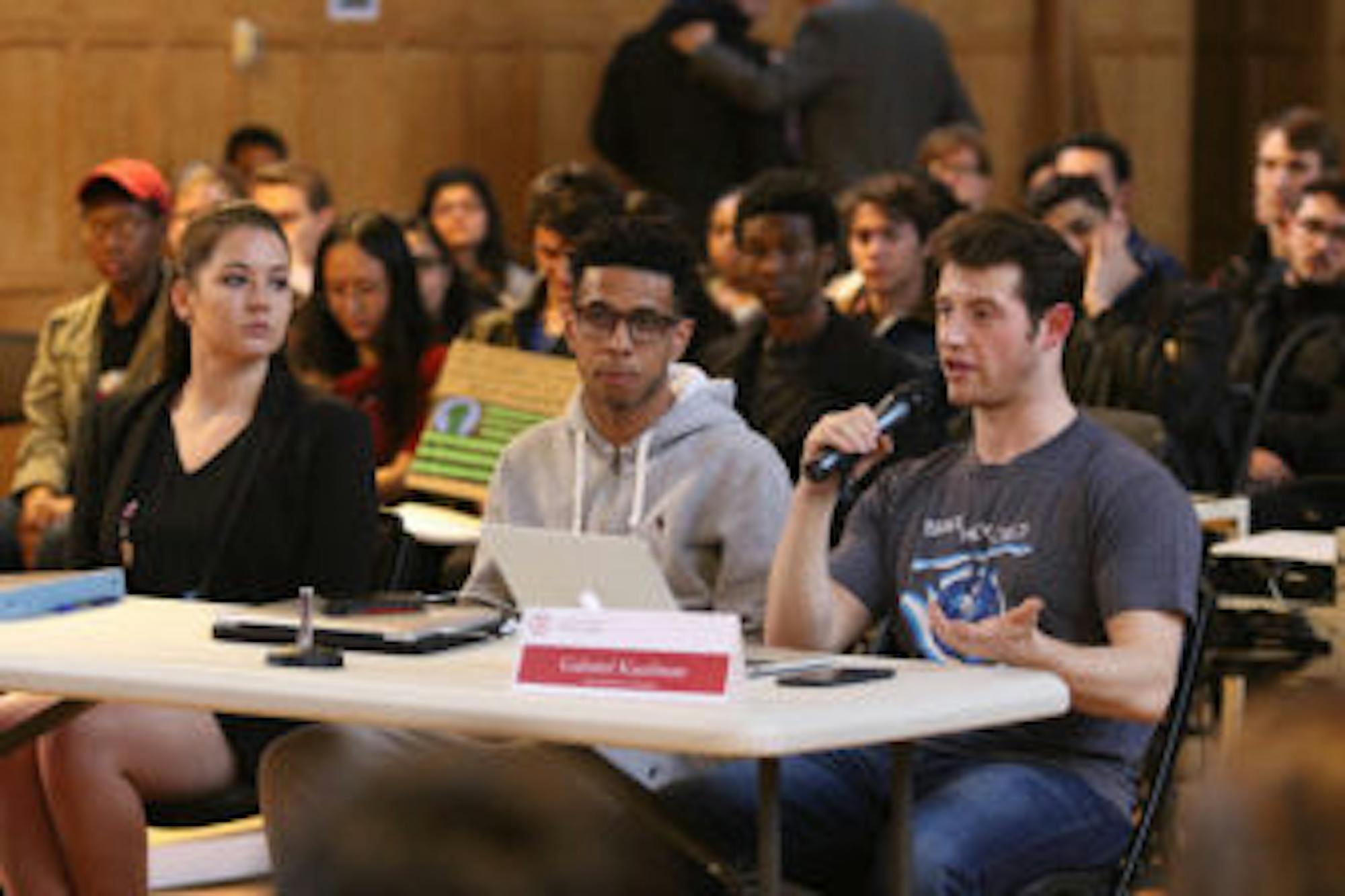 Gabe Kaufman '18, S.A. vice president for finance, right, introduced a resolution to invalidate the election committee's announcement and decide the S.A. presidential race based on which candidate earned the most votes.