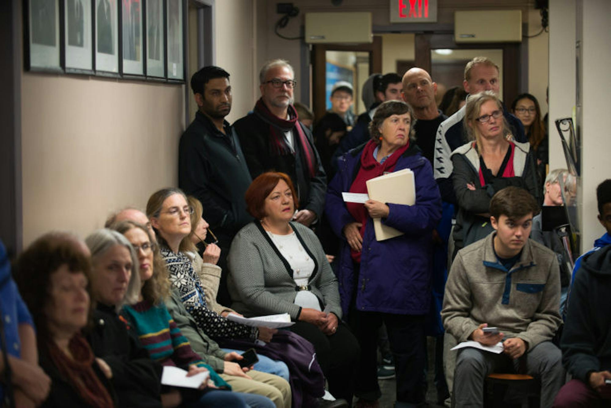 People crowd Ithaca City Hall at the Common Council meeting on Wednesday, Nov. 1, to hear the final verdict on the Chacona Block’s historical designation. (Cameron Pollack/ Sun Photography Editor)