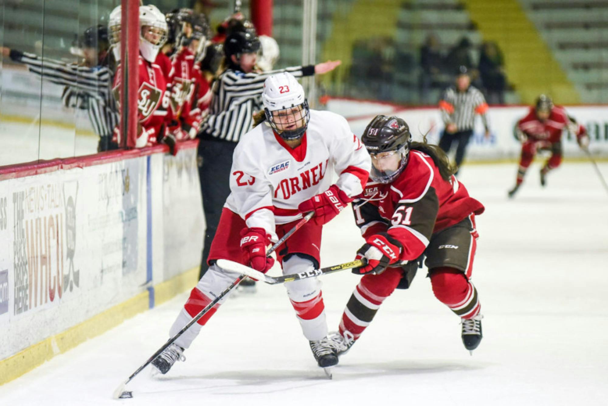 Junior forward Finley Frechette accelerates the puck at the women's hockey game against St. Lawrence on Saturday. (Boris Tsang/Sun Photography Editor)