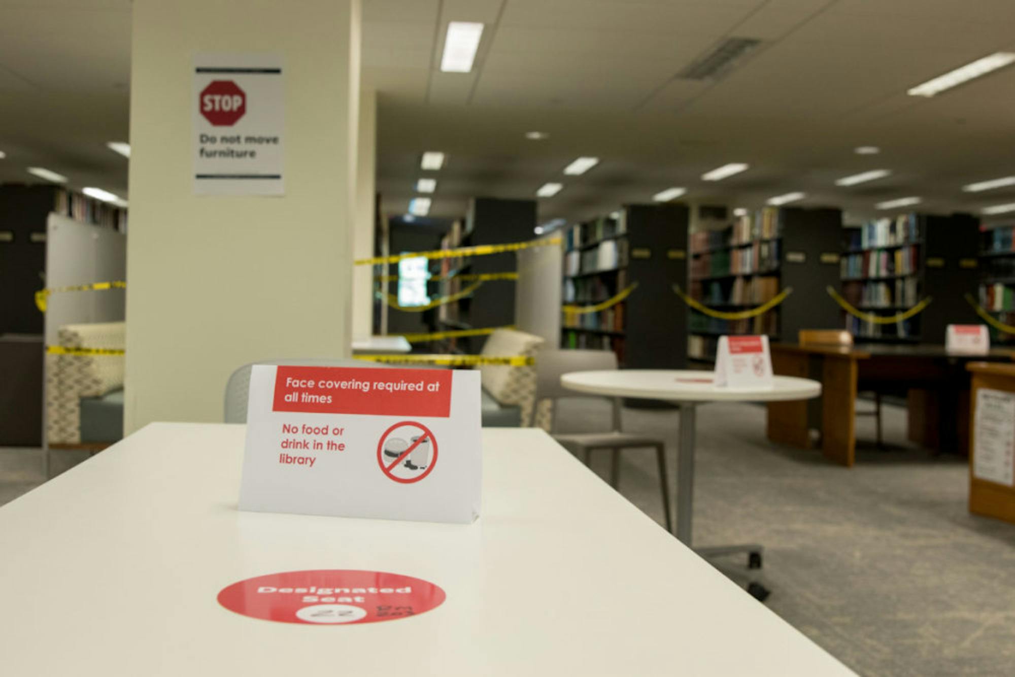 Cornell's campus is full of mask-wearing and social distancing reminders, like this sign in Mann Library.