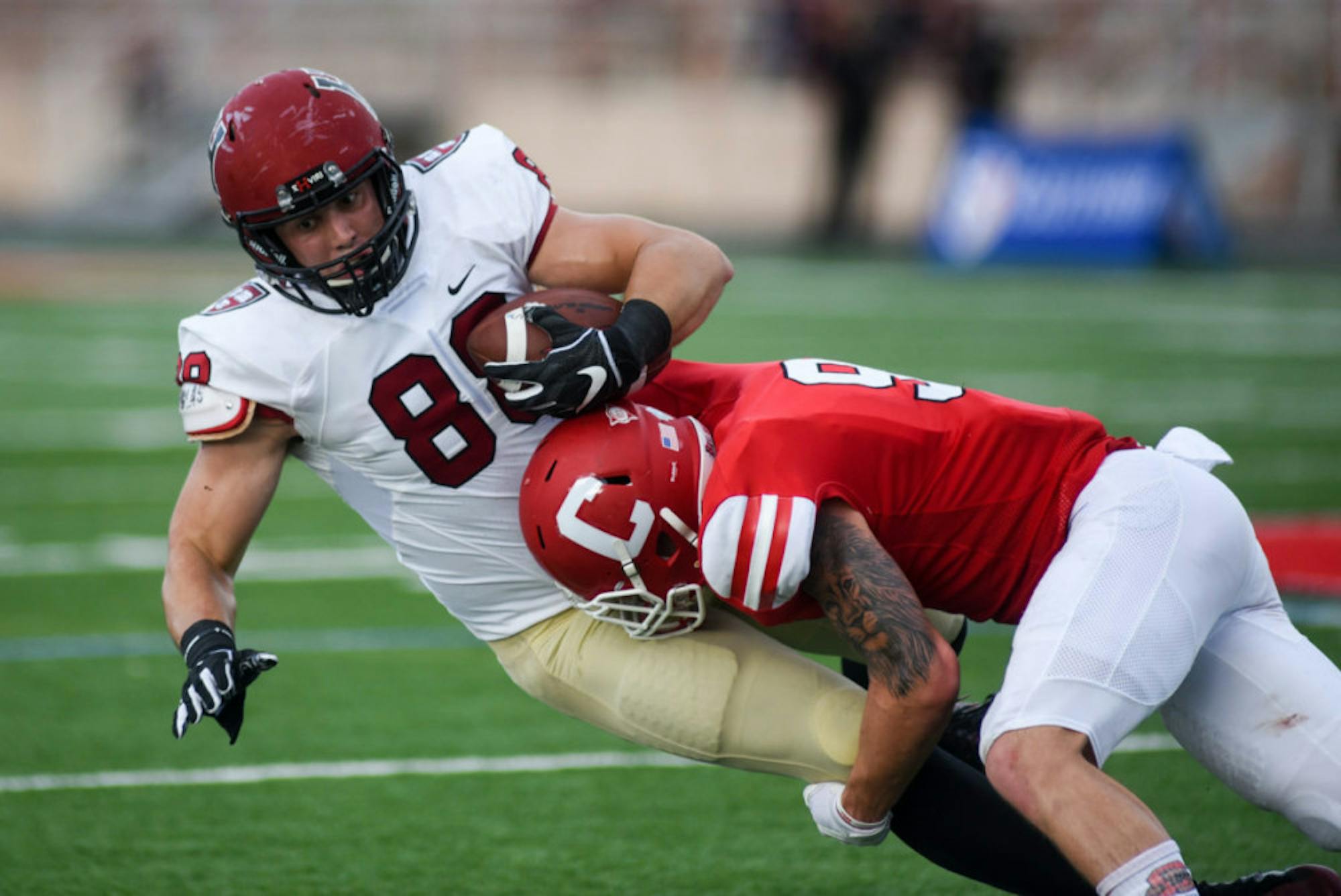 Sophomore safety Logan Thut brings down Harvard's John Stivers. The Cornell pass defense forced Harvard to change quarterbacks mid-game and held the Crimson air attack to just 137 yards.