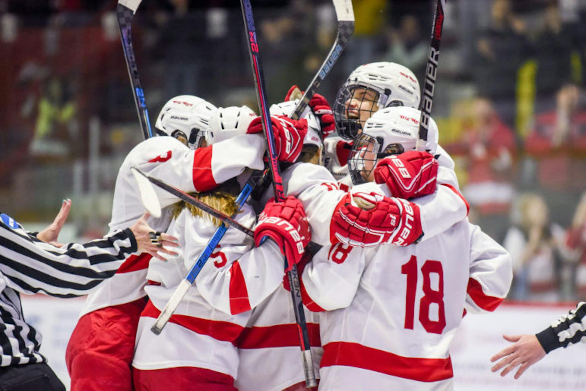 The women's hockey team celebrates after a goal from sophomore forward Gillis Frechette, putting the Red up 2-0 at the ECAC championship game against Princeton on Sunday. The game ended in a 3-2 Big Red overtime loss. (Boris Tsang/Sun Photography Editor)