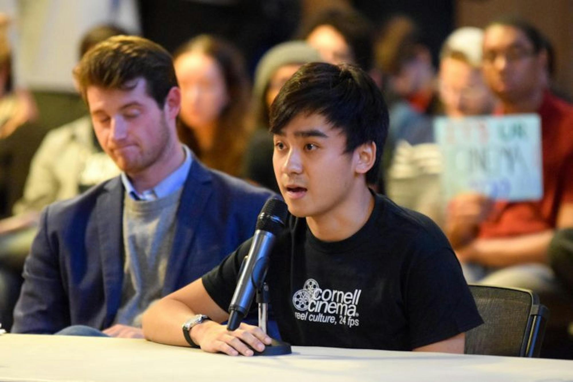 Yuji Yang ’19, president of the Cinema’s student advisory board (right) speaks at last Thursday's S.A. meeting after Gabriel Kaufman ’18 (left) took the floor.