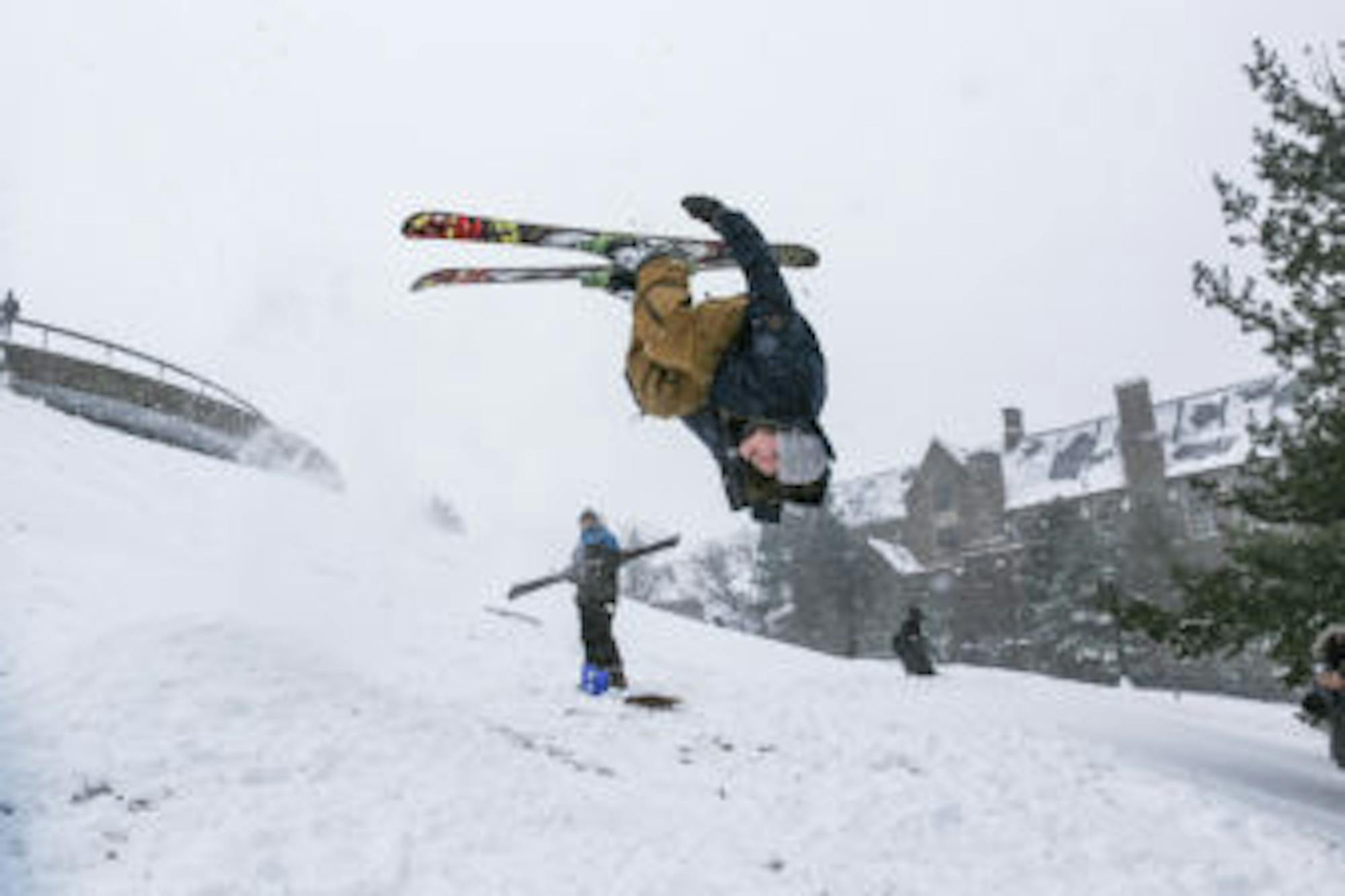Student performs a front flip at Libe Slope during Snow Day on March 14, 2017. ( Katie Sims / Sun Staff Photographer ) Download permissions