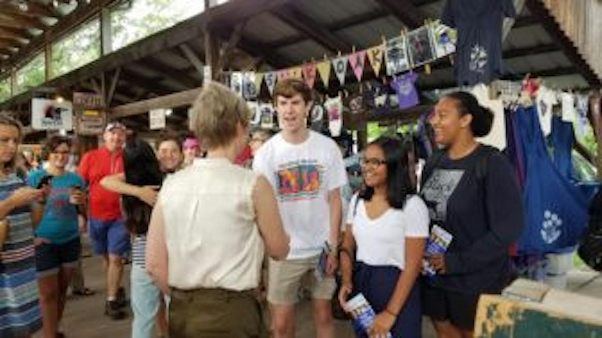 Nixon met with local supporters at the farmers' market, including Cornell juniors Andrew Kohler ’20, Shaloni Pinto ’20 and Leah Moore ’20.