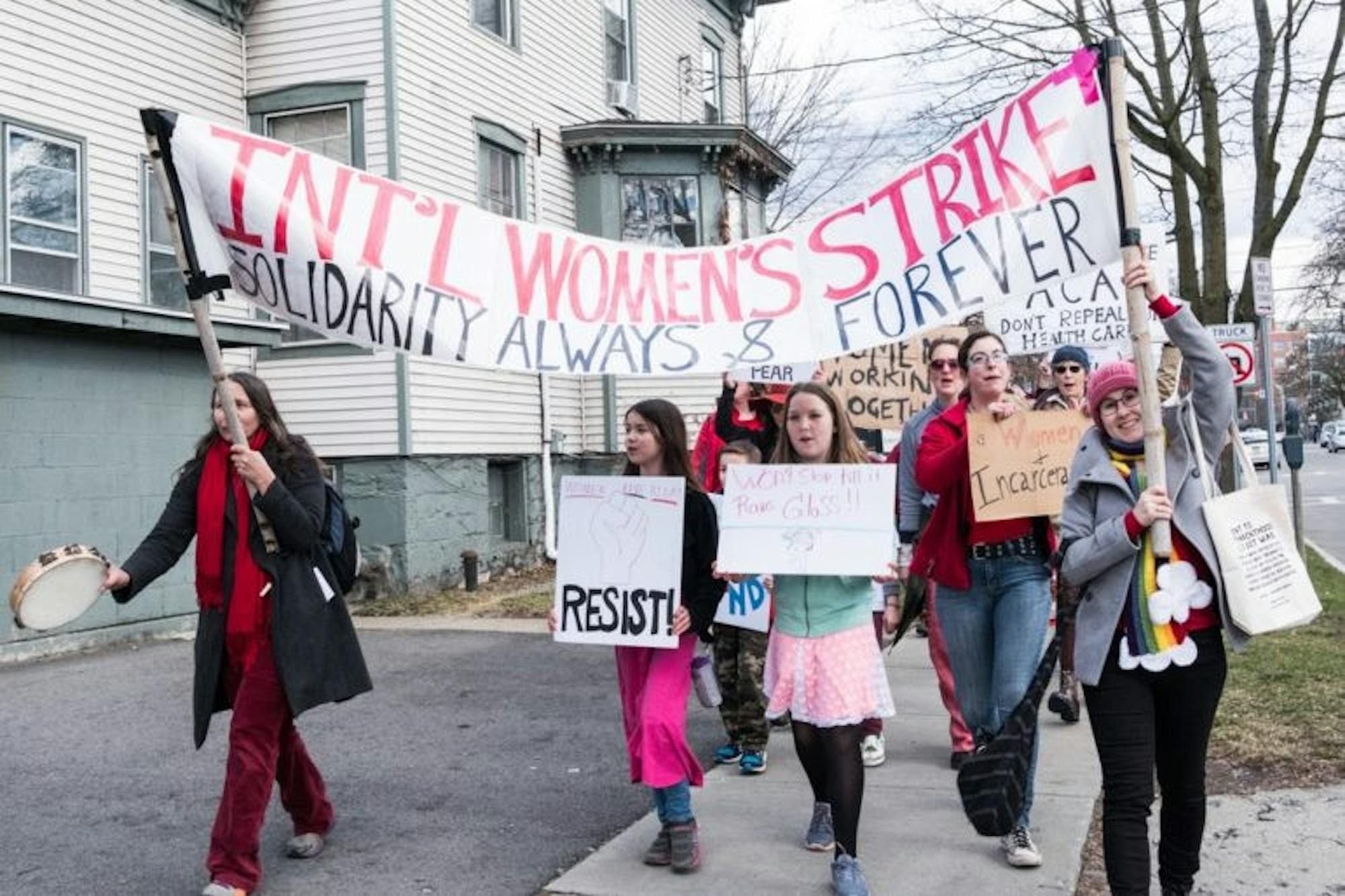 Nearly 200 people marched along a 1-mile route in Ithaca on Wednesday for International Women's Day.