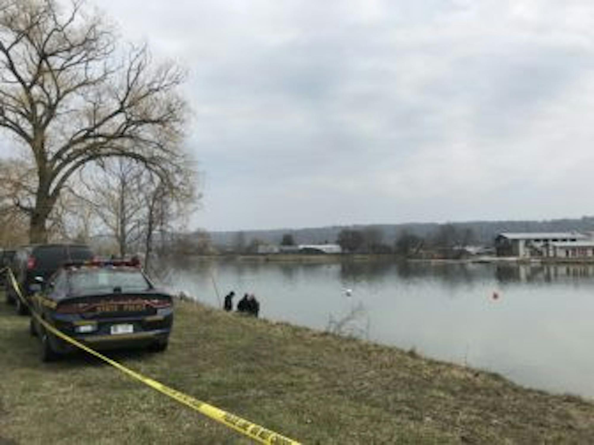 New York State Police divers search the Cayuga Inlet, where they found a handgun connected to Reynolds in April 2018.