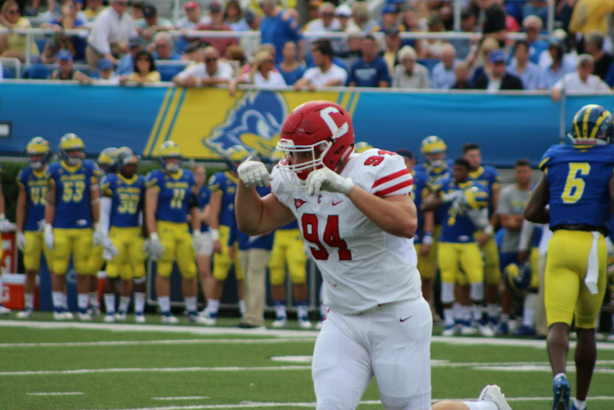 Junior defensive lineman Jordan Landsman celebrates a failed third down conversion for Delaware. The Cornell defense started well and kept the game within reach but was ultimately burned by big plays.