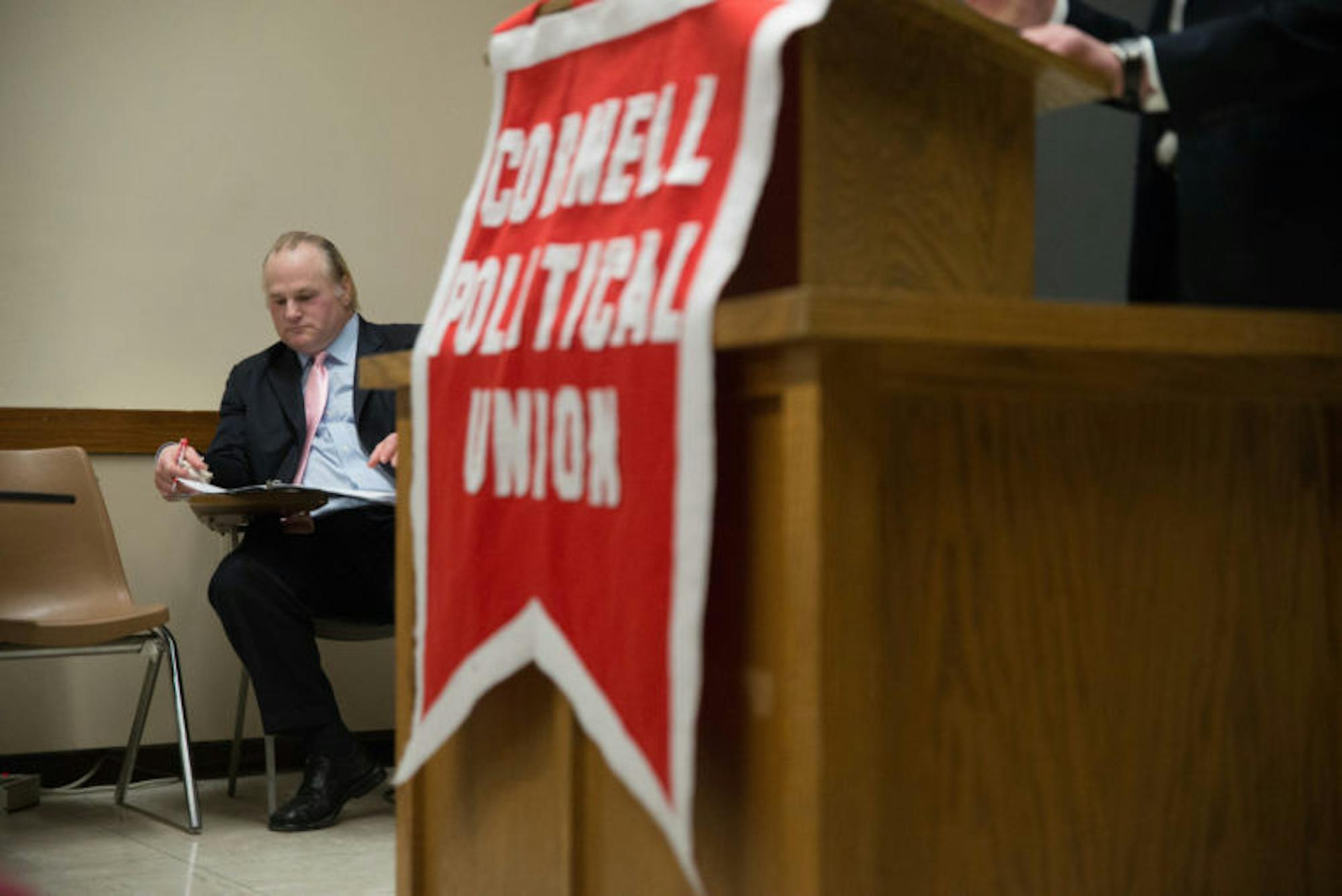 Michael Johns, leader of the Tea Party, waits to speak in Rockefeller Hall on Tuesday Evening.