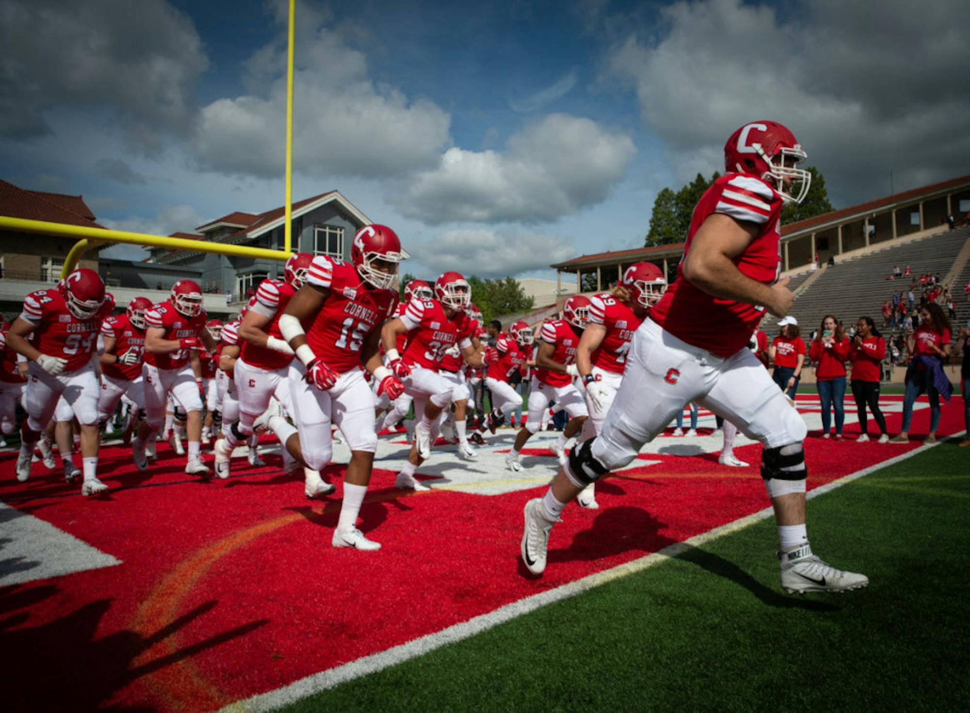 Cornell rushes onto the field in front of 11,400 Homecoming fans.