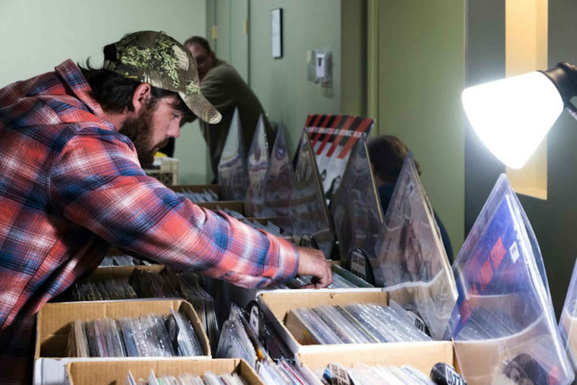 Local residents explore the LP Vinyl Records and CDs Show at The Space at Greenstar on Saturday. (Anant Sriram / Sun Staff Photographer)