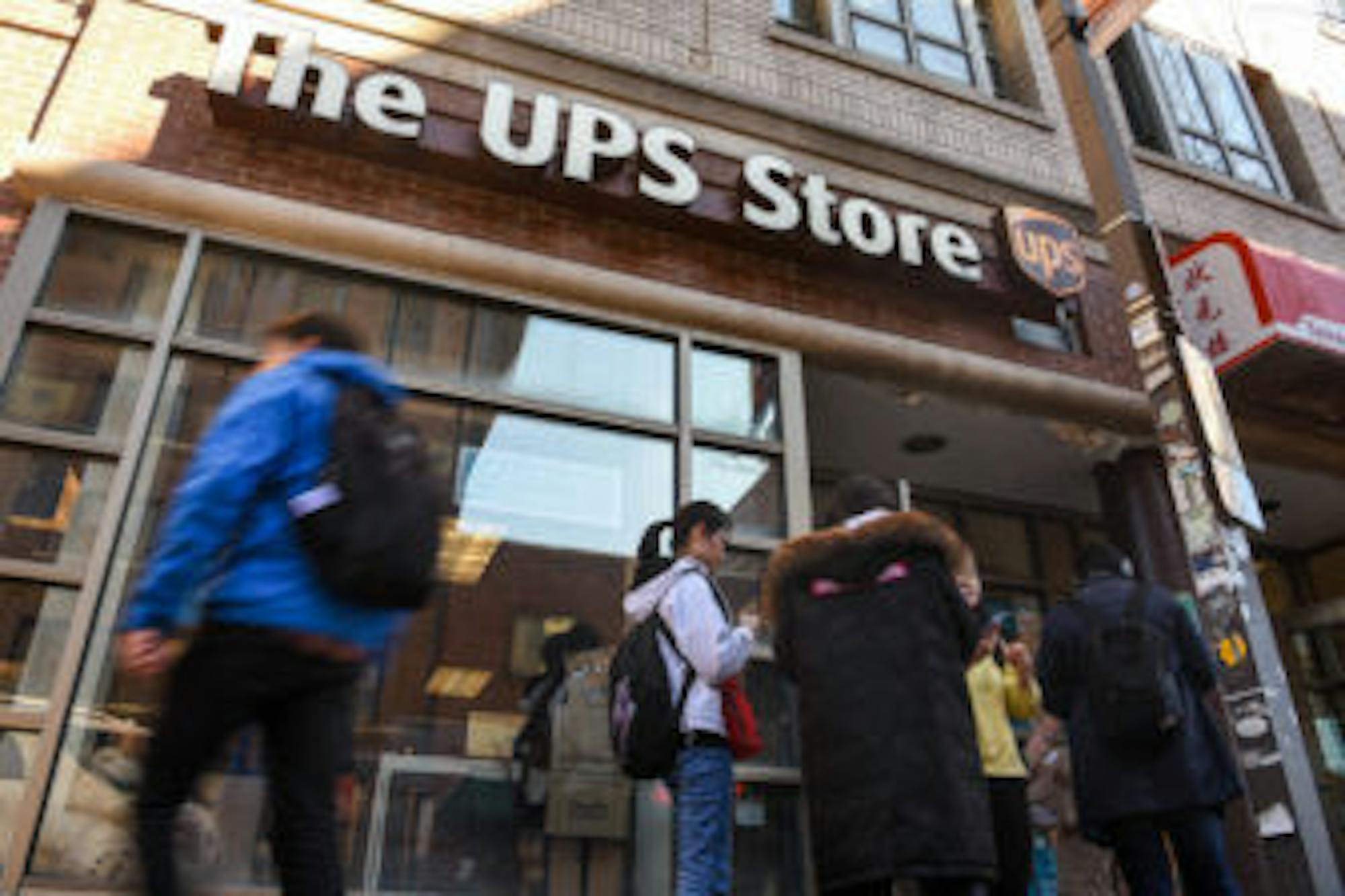 Students line up to buy cardboard boxes at the UPS store in Collegetown after President Martha E. Pollack announced that the University would suspend all classes as of 5 p.m. on March 13, 2020.