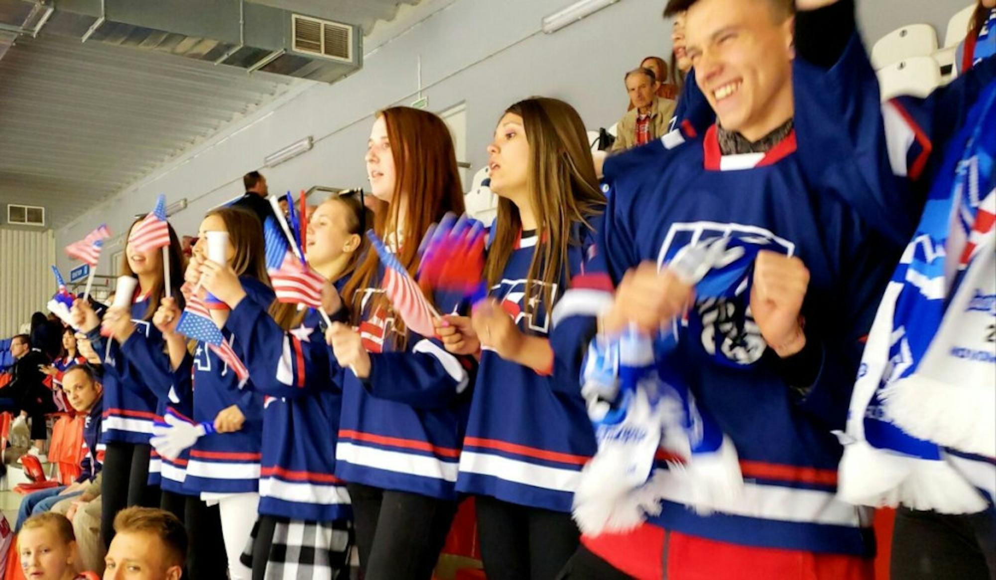 A group of Russian students assigned to cheer on the Capitals fulfills its role from the stands.