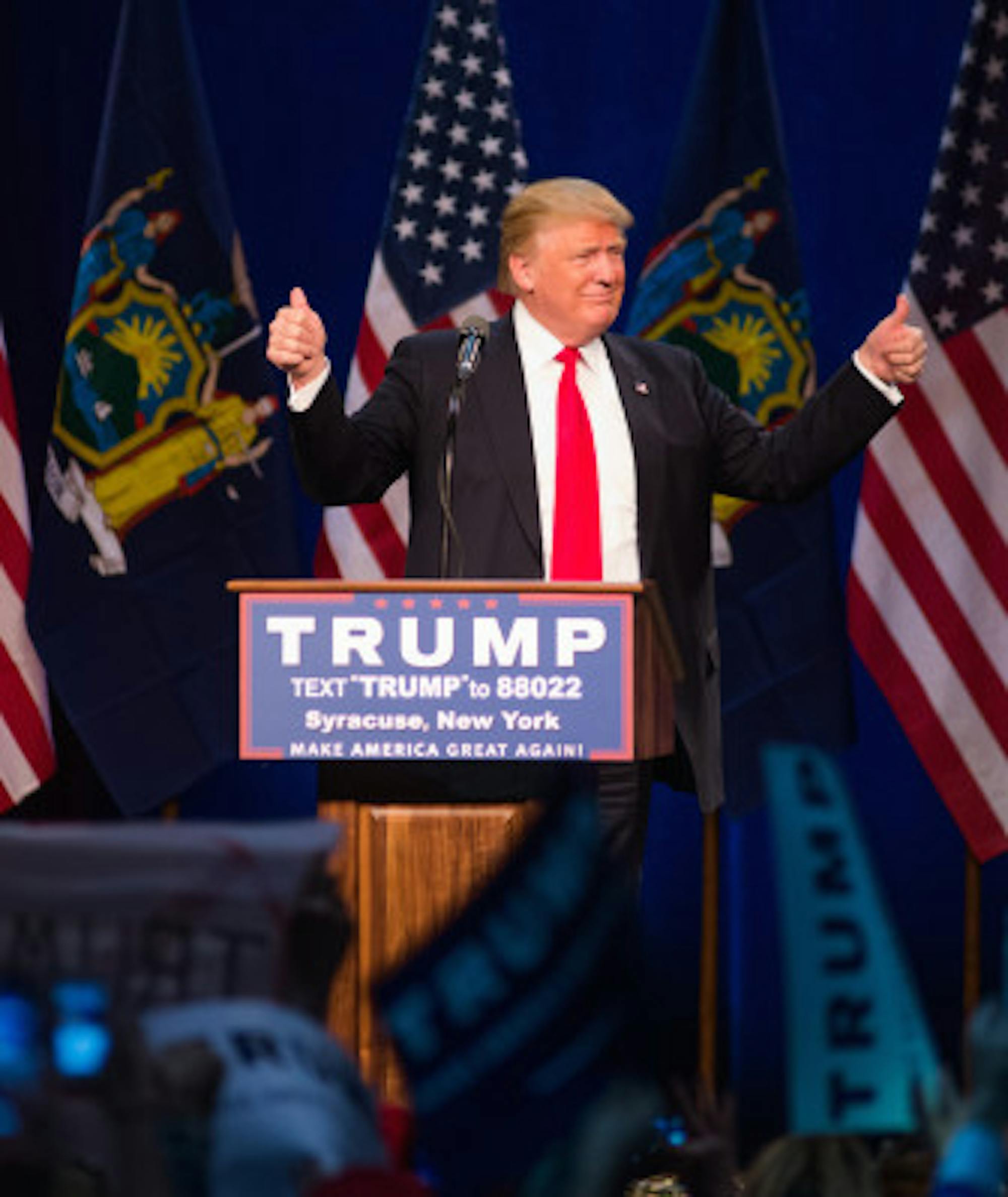 Trump gives a thumbs up to attendees of his Syracuse rally.