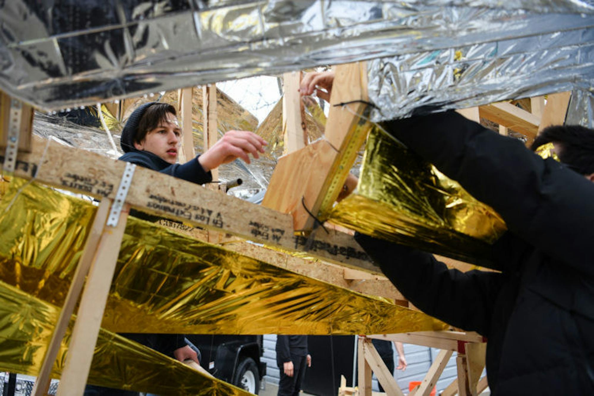 As the rain dissipated, the tarp was removed so students could finish their work on the body. With less than an hour to go, Jack Otto ’22 stands inside the frame to assist with the final assembly.