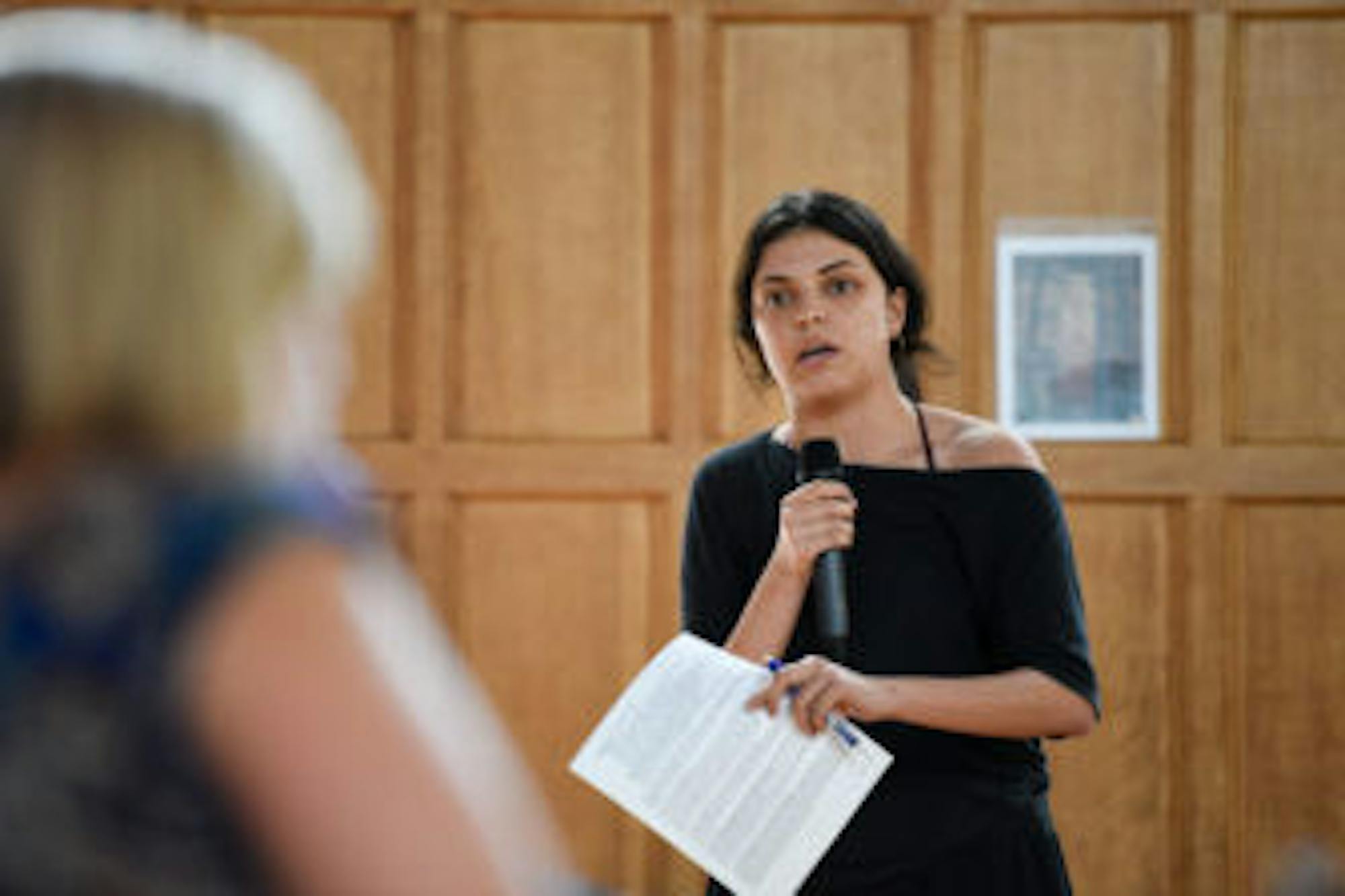 Zelia Gonzales ’20, an audience member, confronts the administrators.