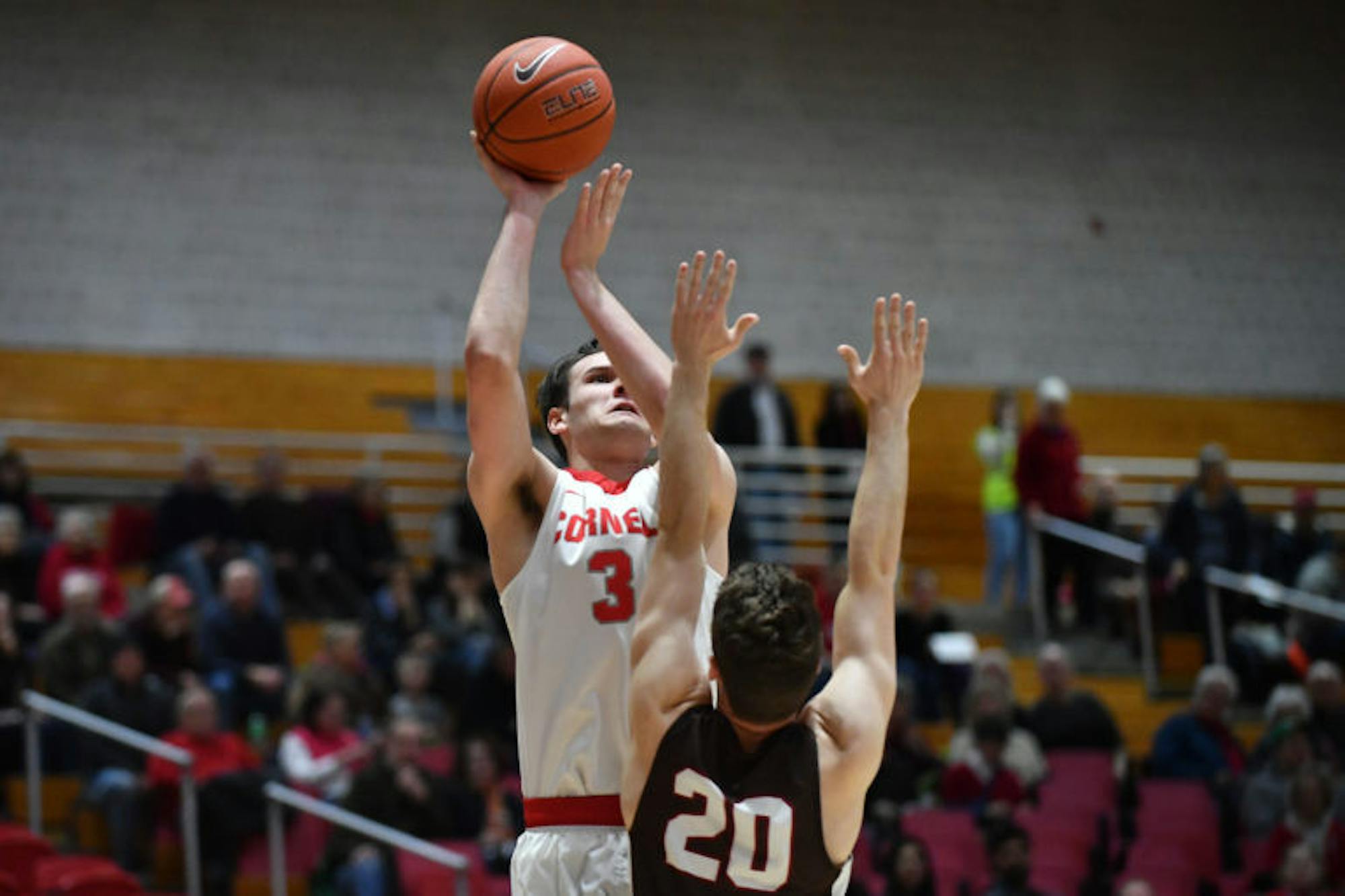 Freshman forward Jimmy Boeheim elevates over a Brown defender on Friday. With 21 points overall, Boeheim led the Red to a 70-66 overtime win. (Ben Parker / Sun Staff Photographer)