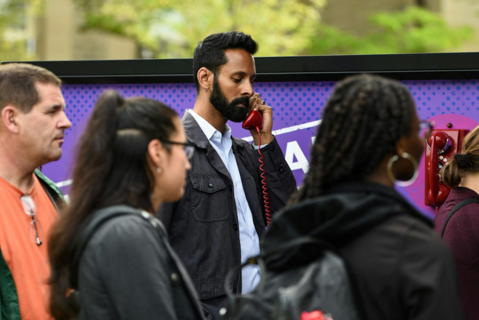 Dean of Students Vijay Pendakur listens to one of the simulations.