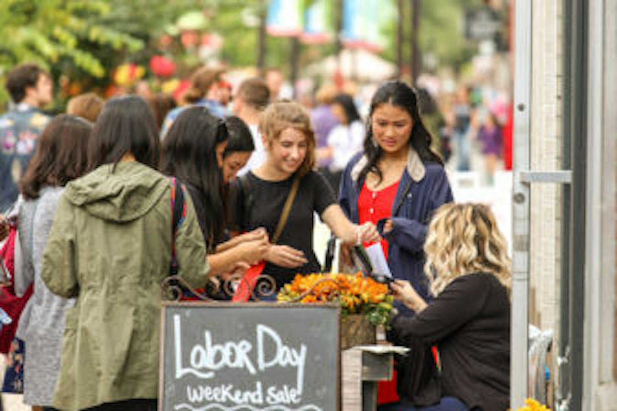 Students explore the shops and festivities in the Commons on Saturday.