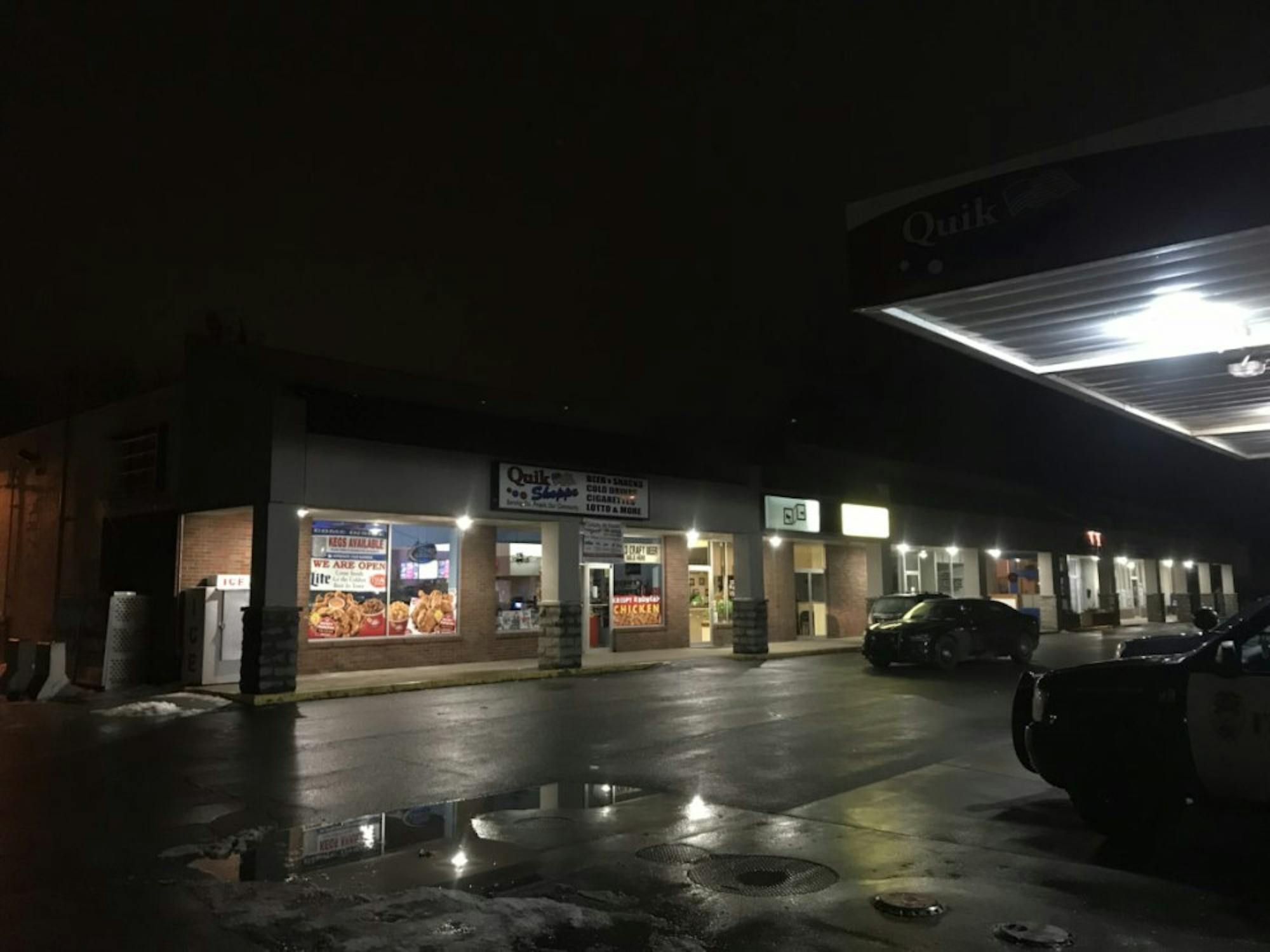 Several Ithaca Police cars were parked outside of Quik Shoppe on Sunday night as police searched for a suspect in the armed robbery.