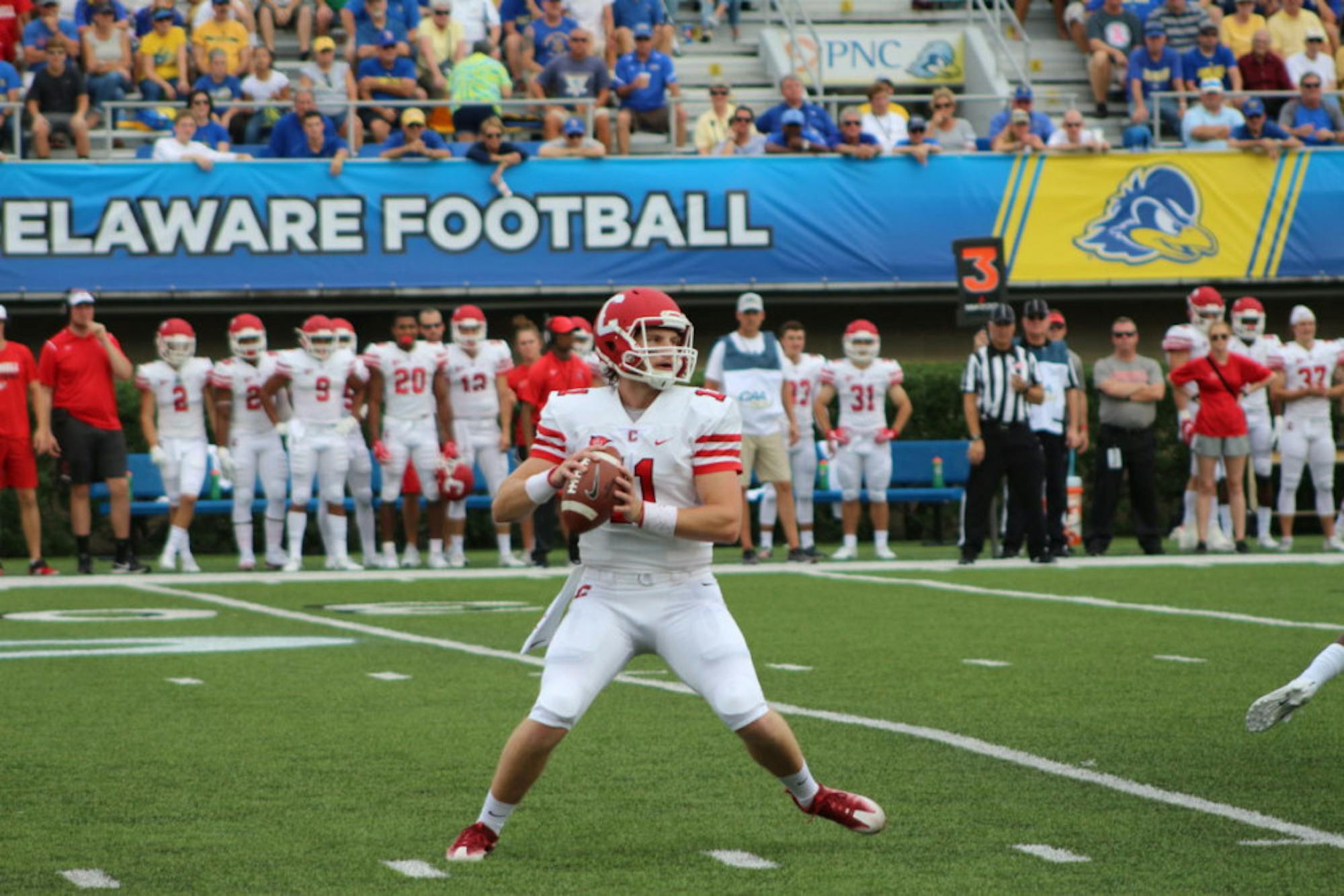 Sophomore Richie Kenney drops back to pass in Saturday's loss to Delaware. In his first varsity action, Kenney 4-for-9 with 30 yards in the air.