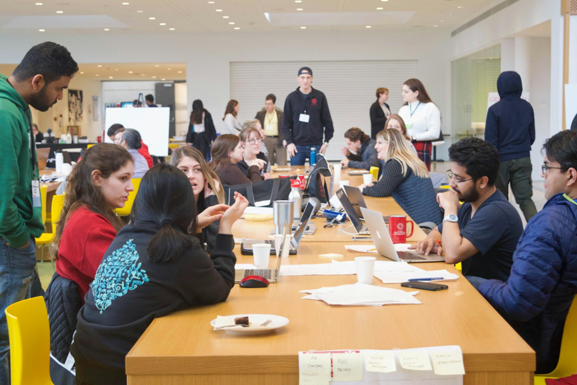Groups work together at the Cornell Animal Health Hackathon, held in the Cornell Vet School on Sunday and the two previous days. Participants, whose backgrounds span from engineering, veterinary medicine to business, solved animal health challenges over the course of the Hackathon. (Nandita Mohan/Sun Staff Photographer)