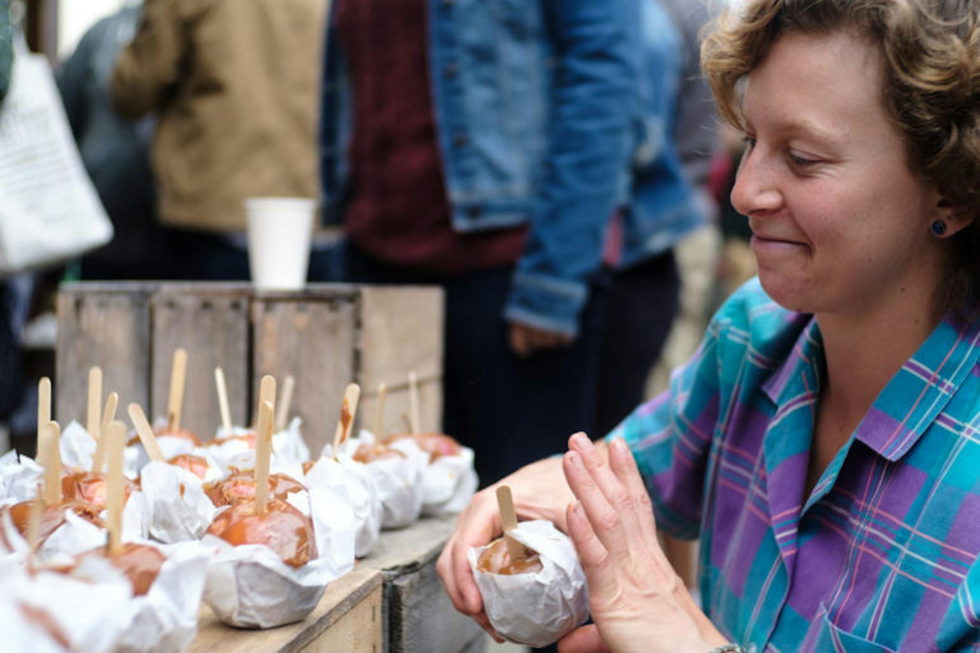 Stalls selling caramel apples, apple cider donuts and apple crisps are the most popular at Apple Harvest Festival on Sept.30, 2017. (Michael Suguitan/Sun Staff Photographer)