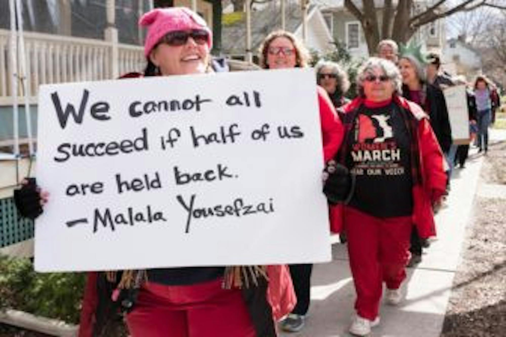 Demonstrators at the Ithaca Women's Day March on Wednesday that began at Ithaca City Hall. (Michael Suguitan / Sun Staff Photographer).