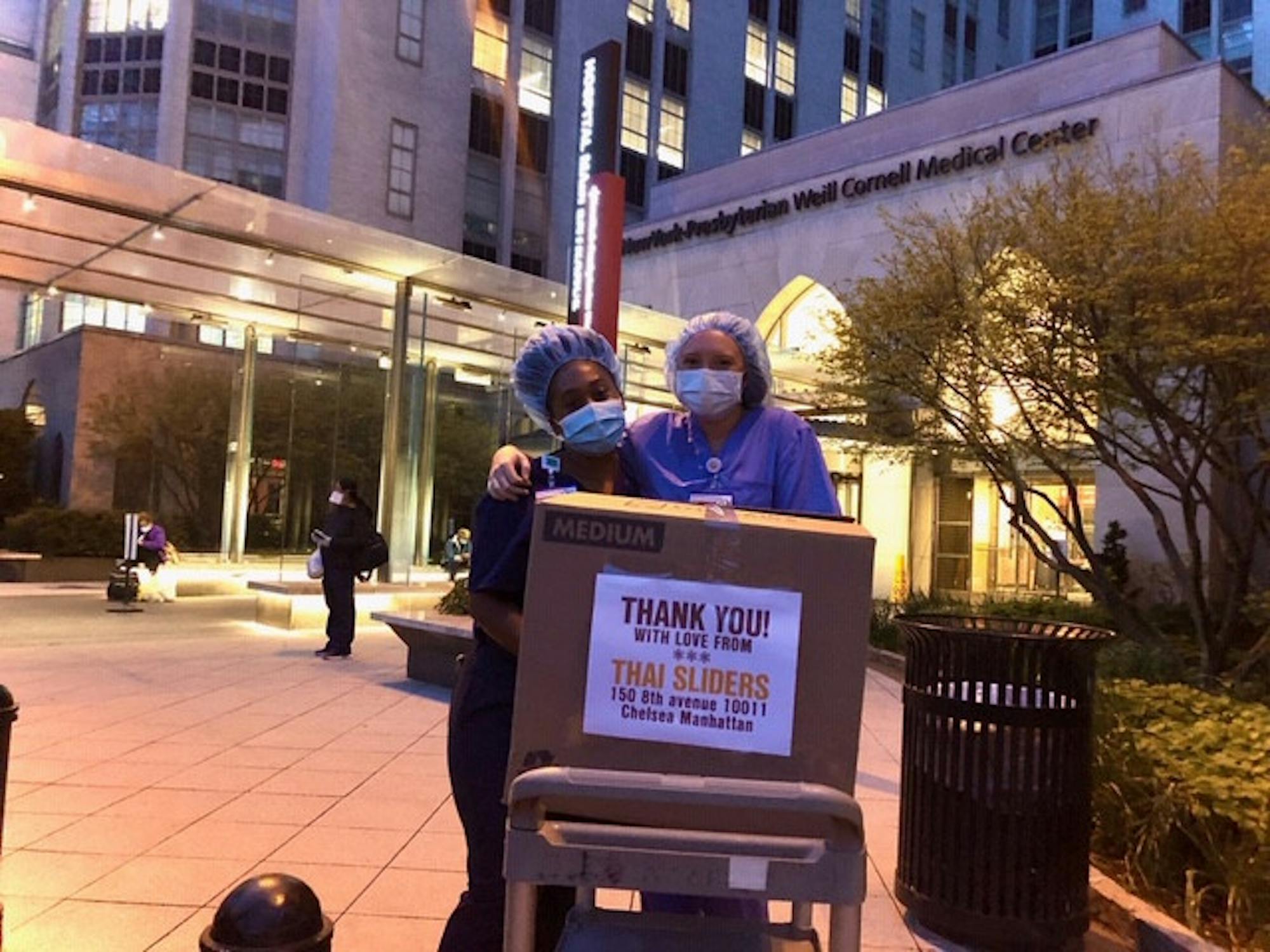 Hospital workers at Weill Cornell Medical Center receiving meal deliveries from Meals 4 Heroes.