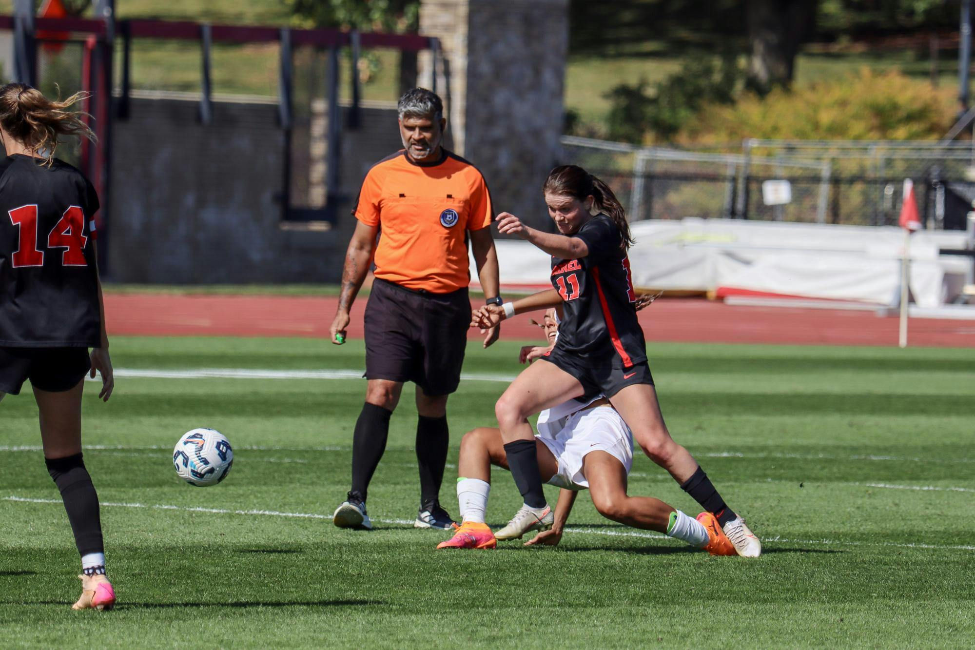 Midfielder Mariana Kessinger '26 contesting the ball at the women's soccer game against Harvard at Berman Field on Oct. 04, 2025. (Dante de la Peña/ Sun Staff Photographer)