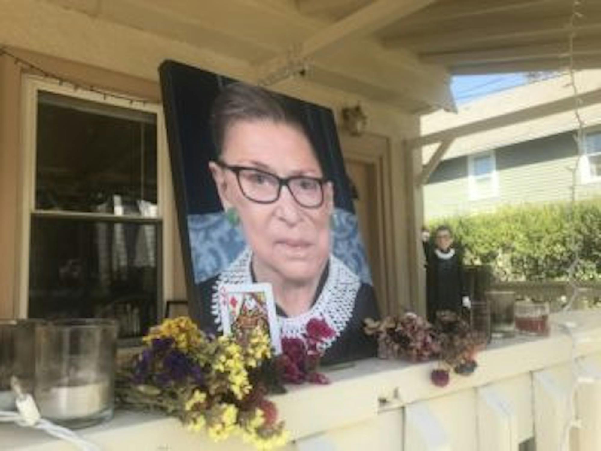 A makeshift shrine in front of a Collegetown apartment sports a portrait of the late justice in her infamous dissenting collar.