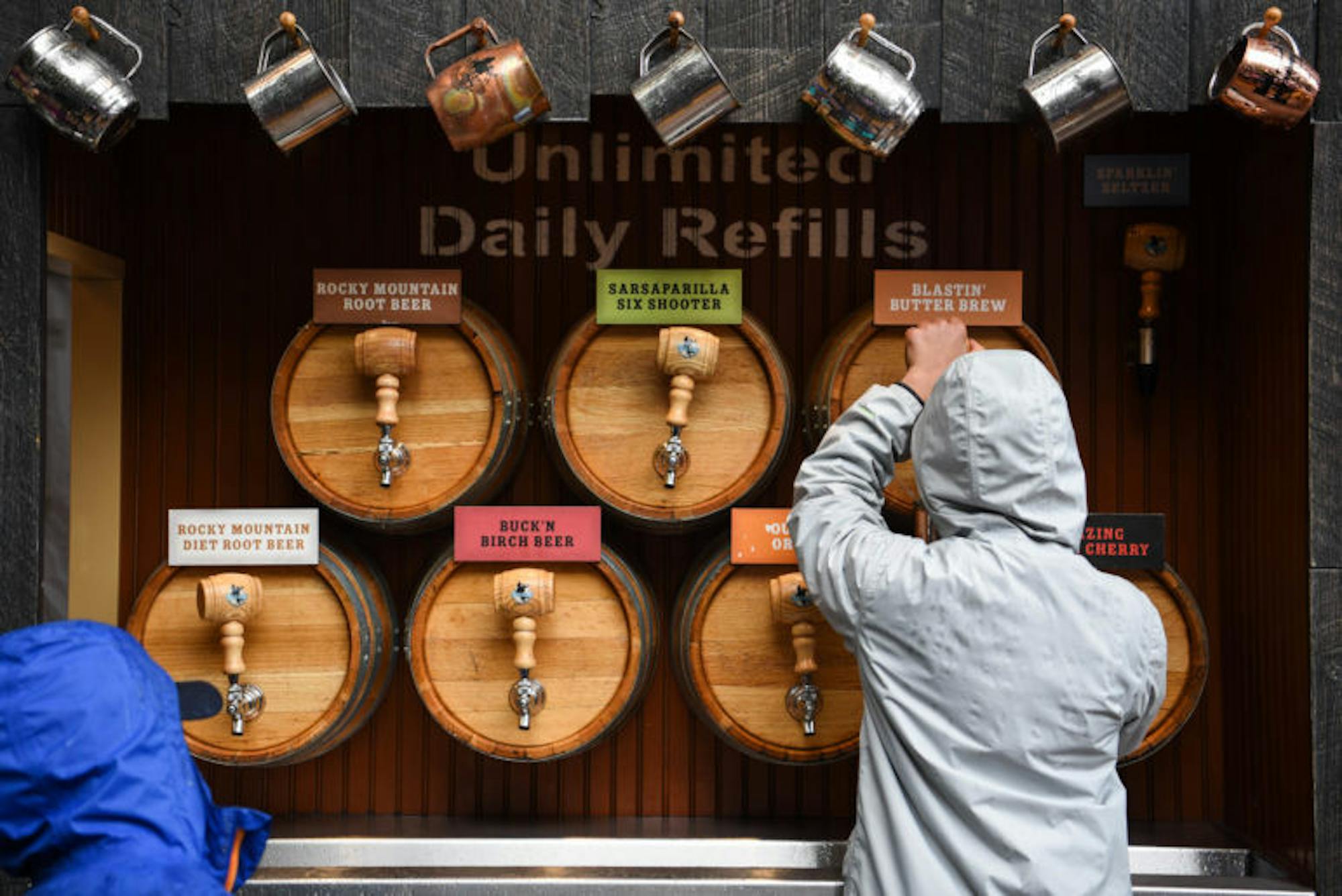Visitors treat themselves to a variety of root beers at Wizarding Weekend in the Ithaca Commons on Saturday. (Boris Tsang / Sun Assistant Photography Editor)