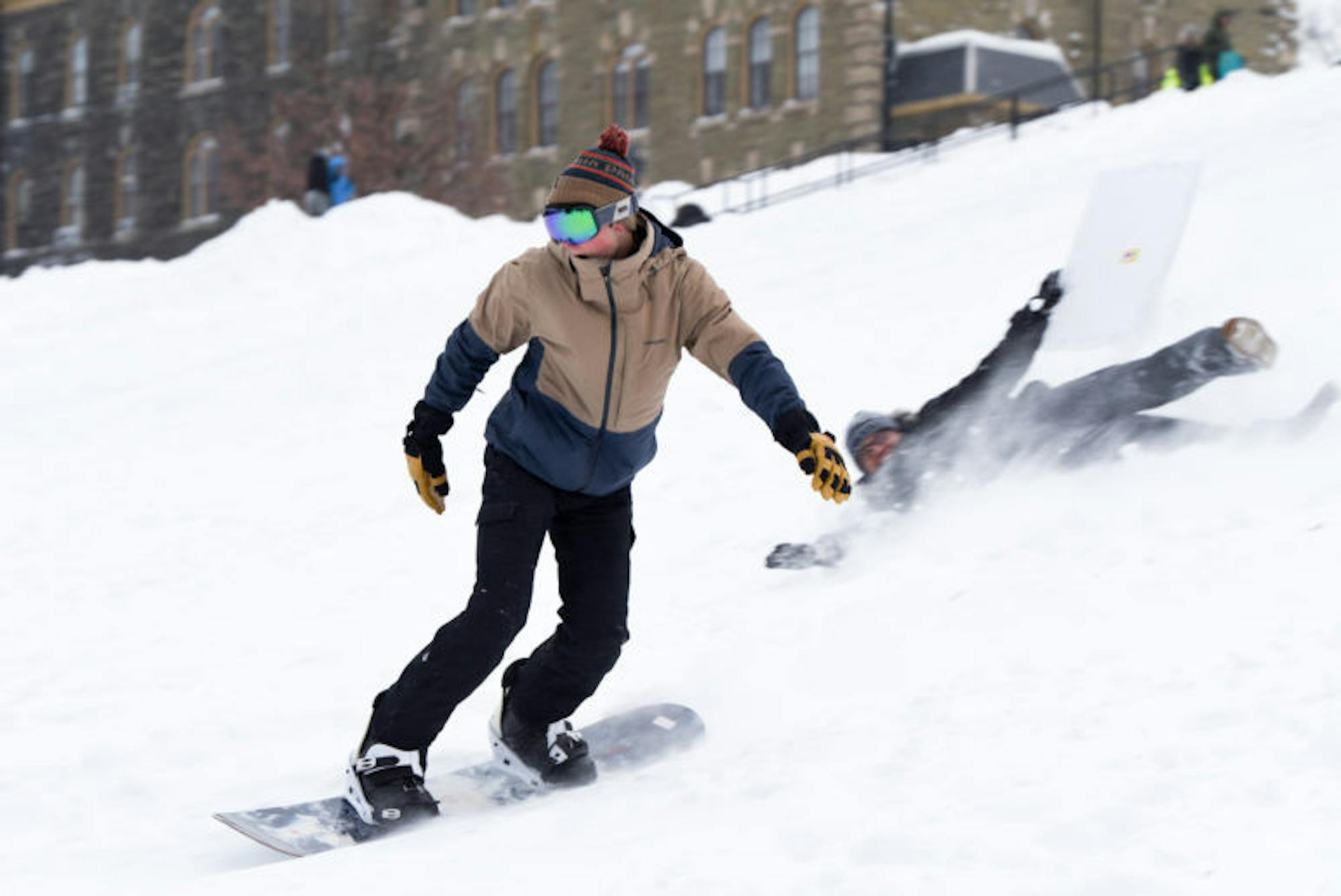 As snow descends on campus, grab a snowboard, a pair of skis, or even a flattened cardboard box and slide (or tumble) down Libe Slope.