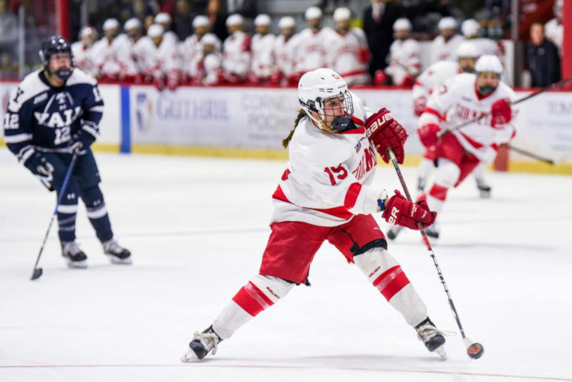 Senior forward Pippy Gerace shoots the puck at the women's hockey game against Yale on Saturday. The Red wrapped up Ivy League play with a 4-0 victory over the Bulldogs. (Boris Tsang / Sun Assistant Photography Editor)