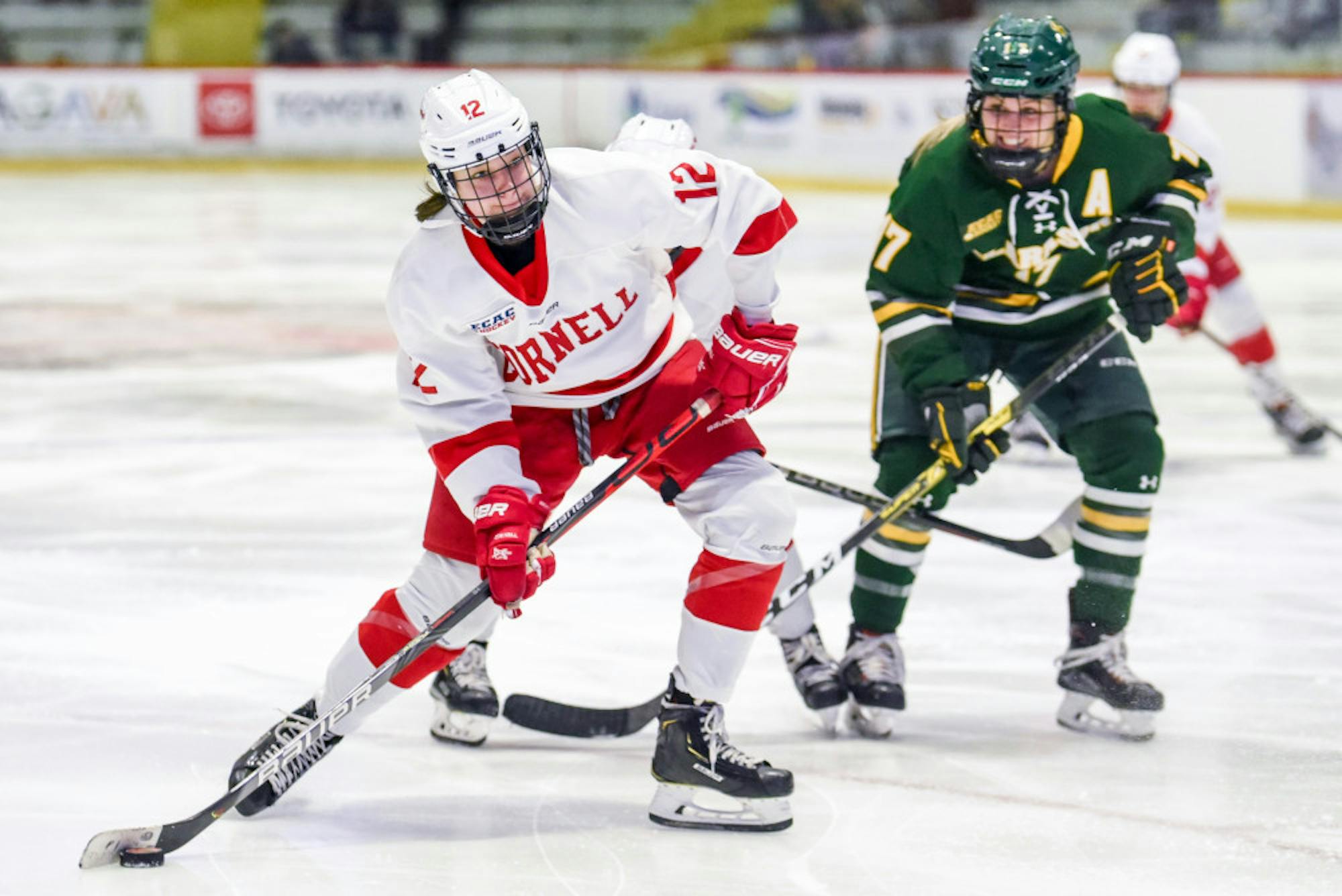 Freshman forward Izzy Daniel moves the puck at the women's hockey game against Clarkson on Friday. After five minutes of overtime, the game ended in a 1-1 tie. (Boris Tsang/Sun Photography Editor)